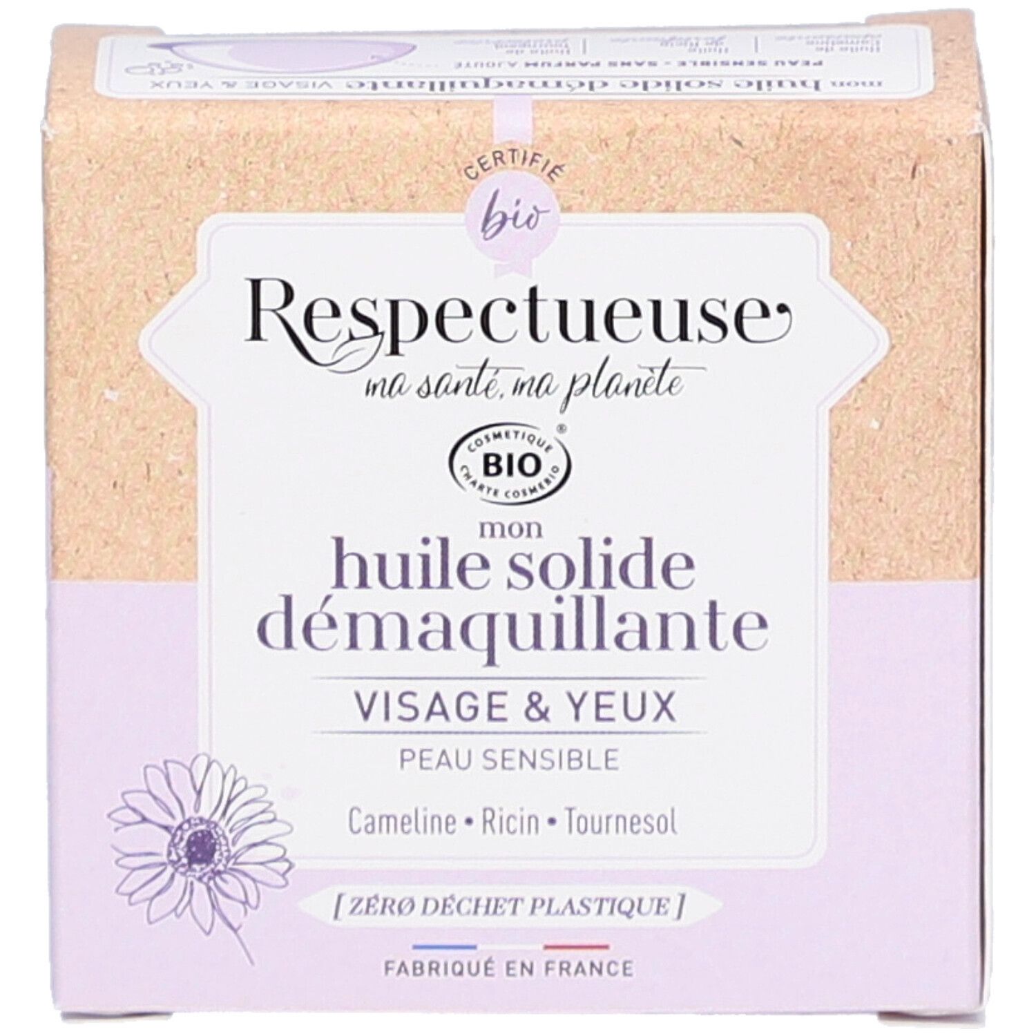 Boîte en carton avec informations produit. Inscriptions: "Respectueuse", "Huile solide démaquillante", "Visage & Yeux". Certification bio.