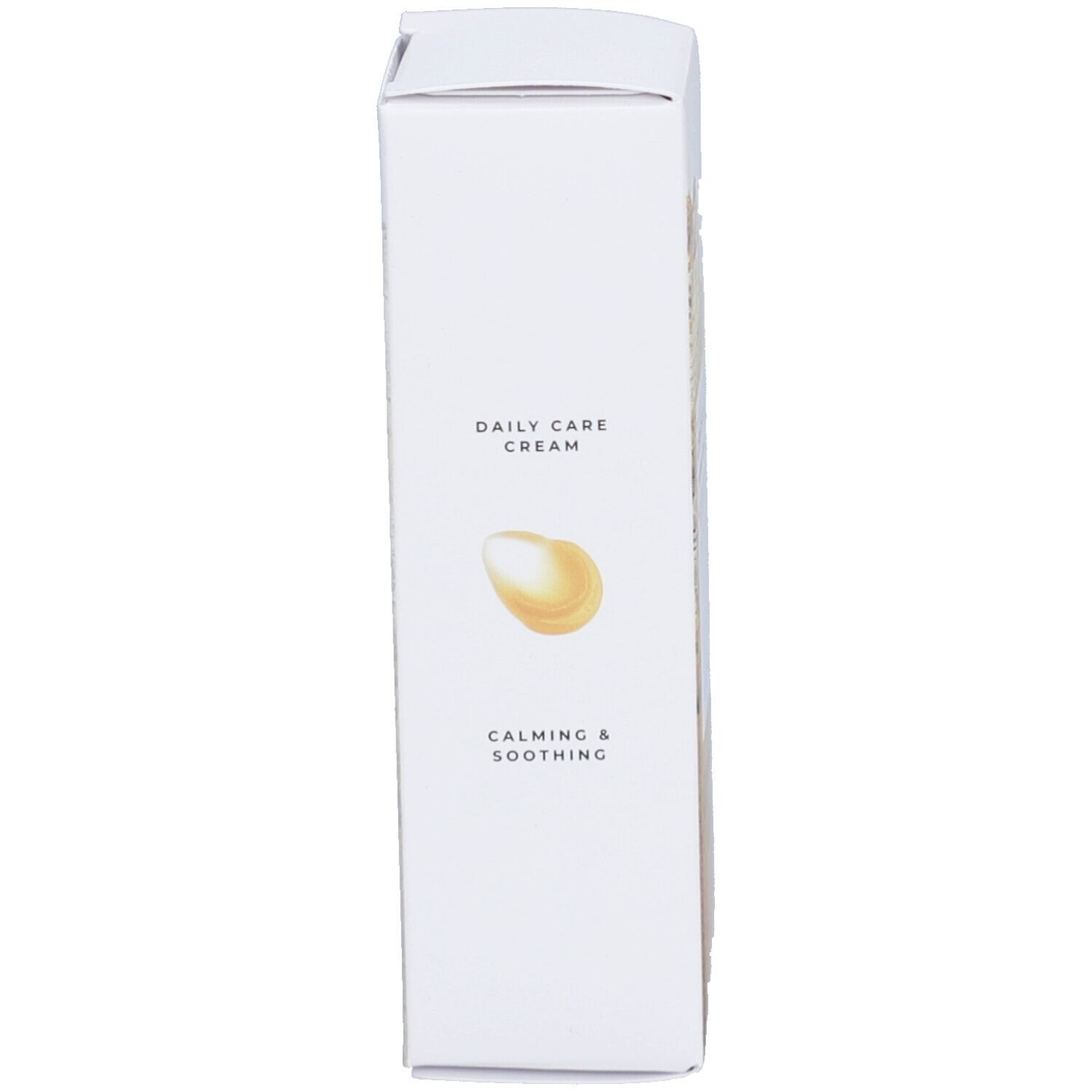 Emballage blanc, côté avec texte: DAILY CARE CREAM, Calming & Soothing, et une goutte jaune.