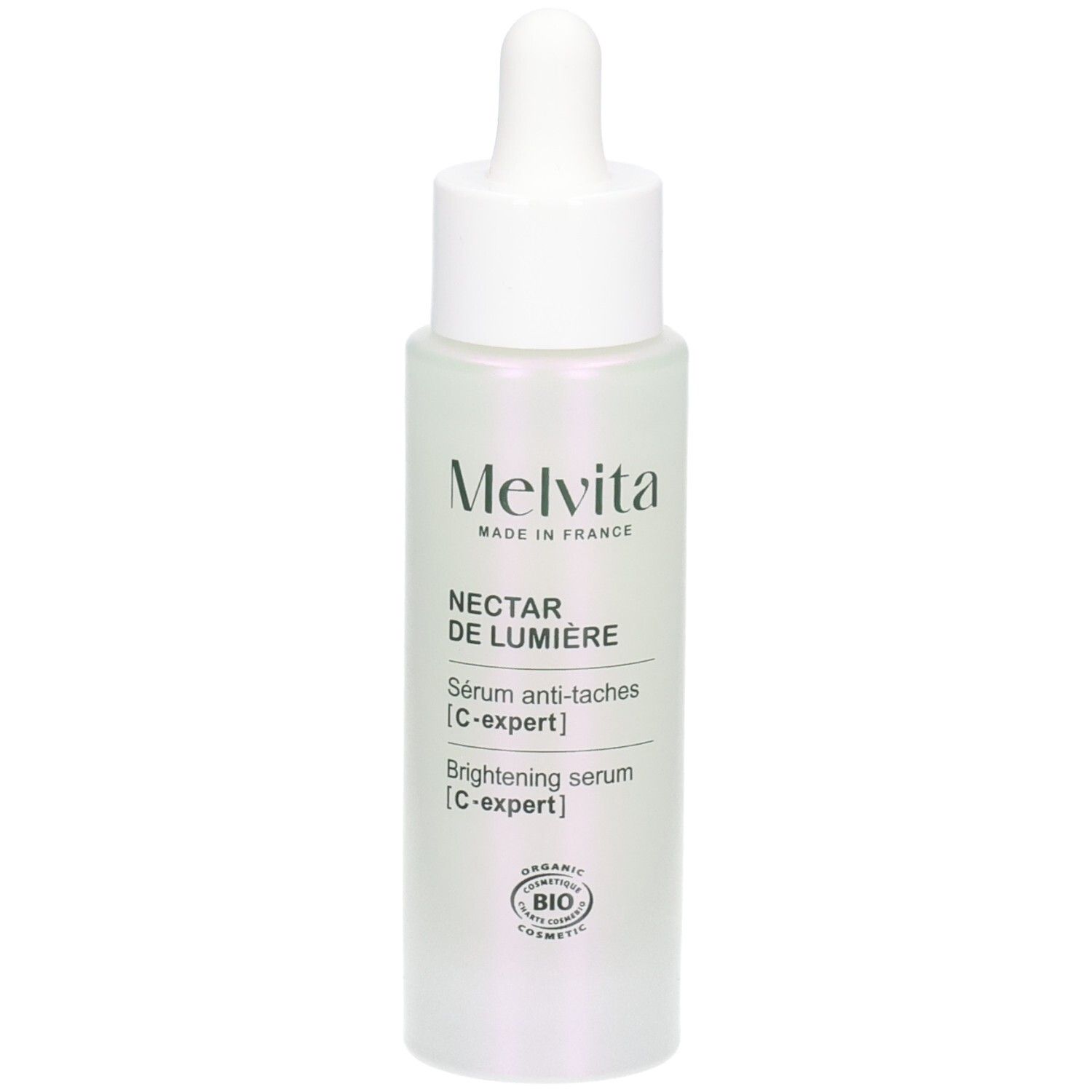 Flacon de sérum avec pipette. Inscriptions: Melvita, Nectar de Lumière, Sérum anti-taches, C-expert, Brightening serum, C-expert.