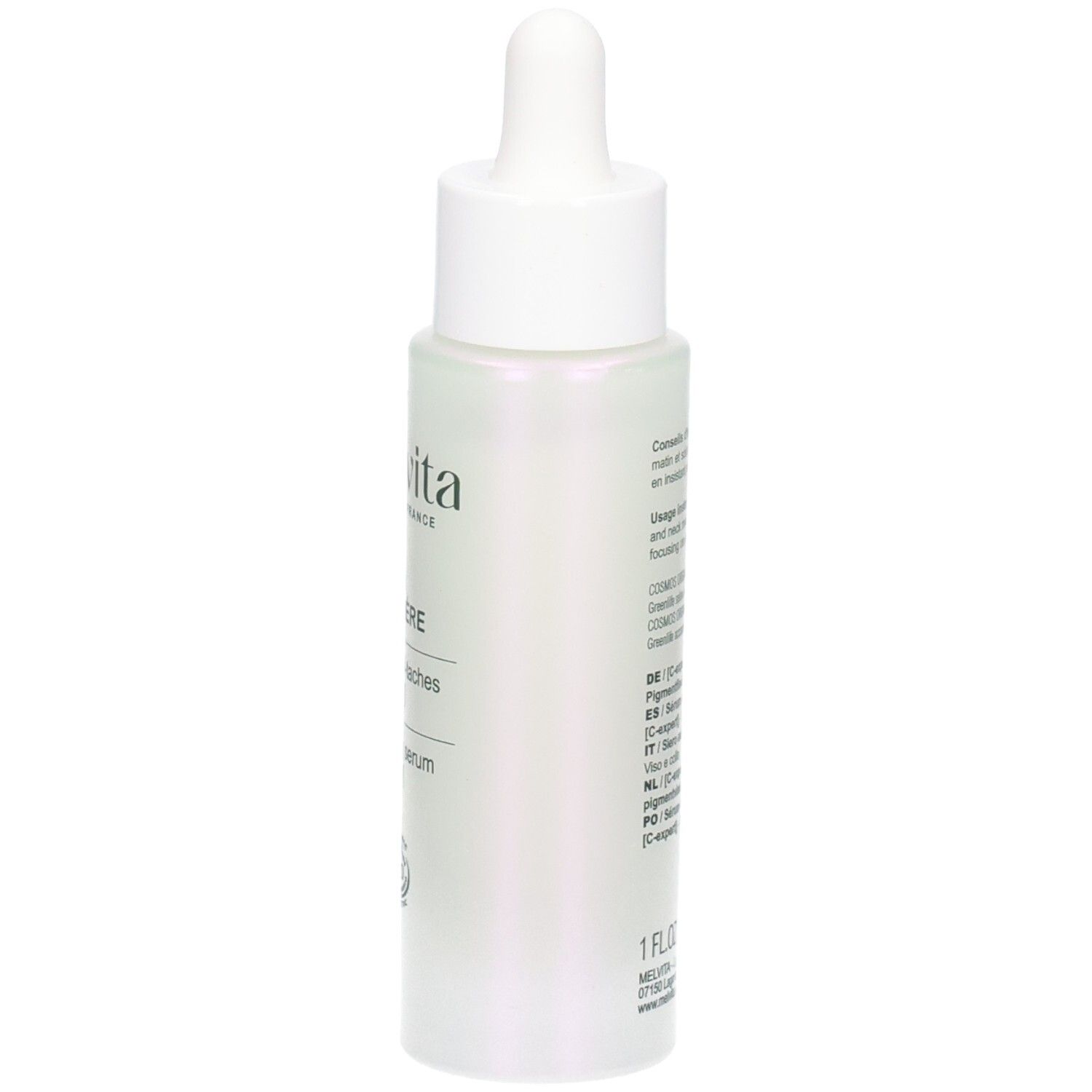Flacon de sérum, dos avec texte. Inscriptions: Nectar de Lumière, Sérum anti-taches, C-expert, Brightening serum, C-expert. Texte multilingue.