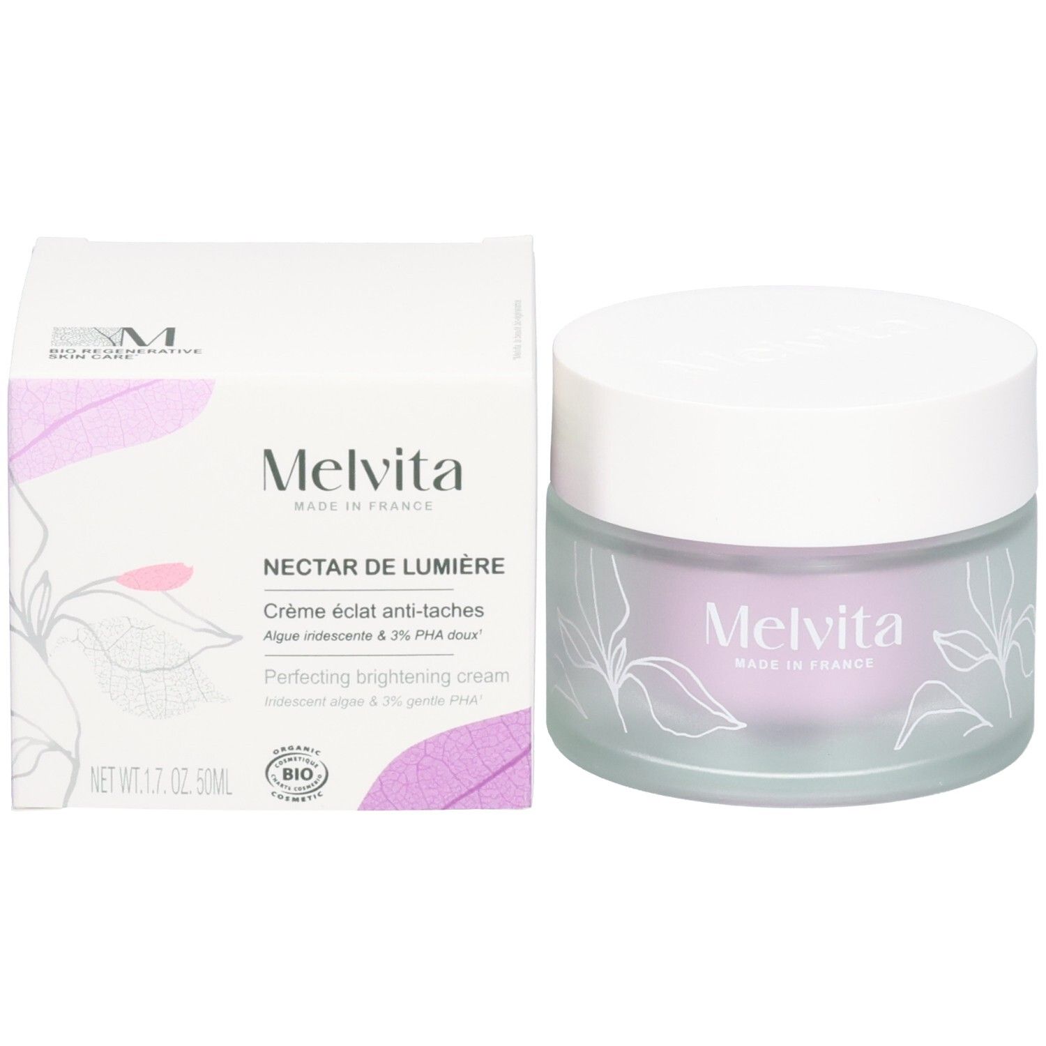 Emballage du produit et pot de crème. Sur l'emballage, on lit Melvita Nectar de Lumière. Le pot a un couvercle blanc.