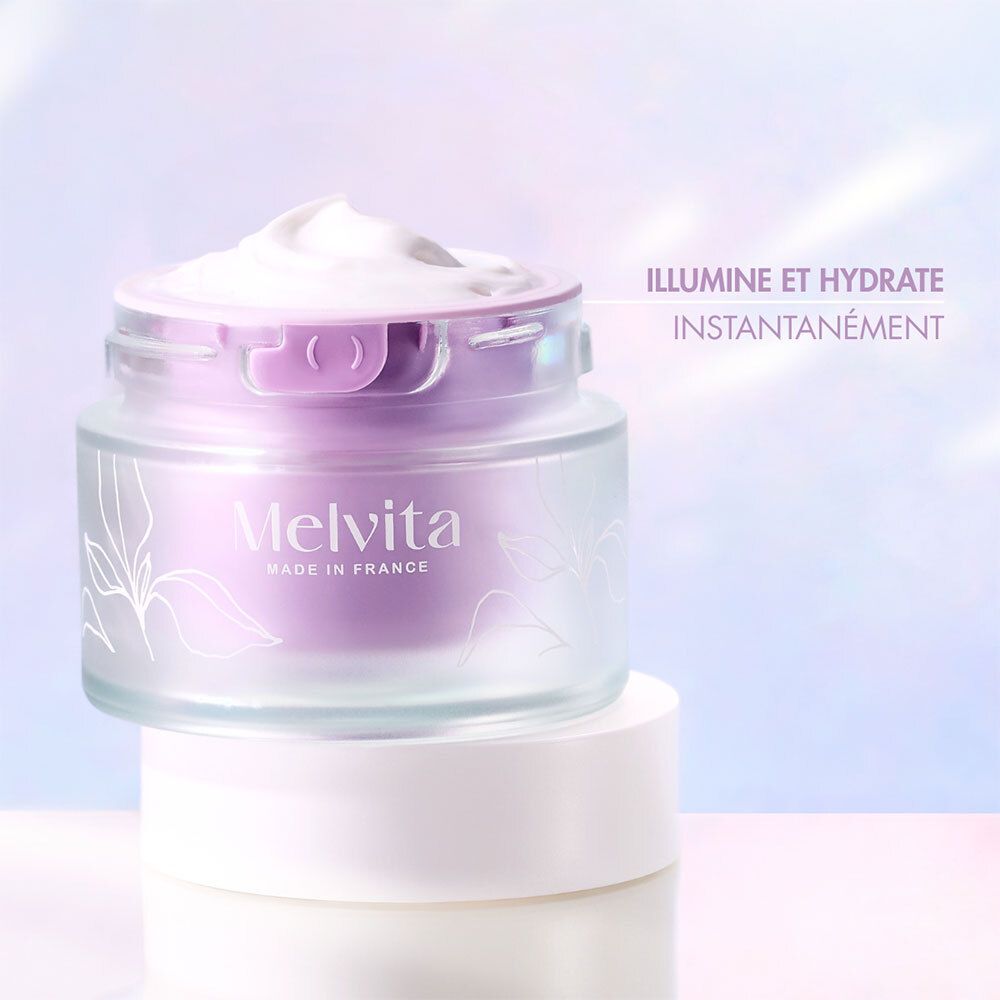Pot de crème sur un autre. Texte : Illumine et hydrate instantanément. Melvita.
