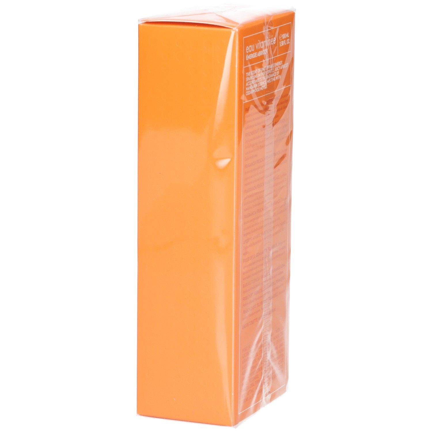 Boîte orange, vue latérale. Texte illisible. Emballé dans du film plastique.