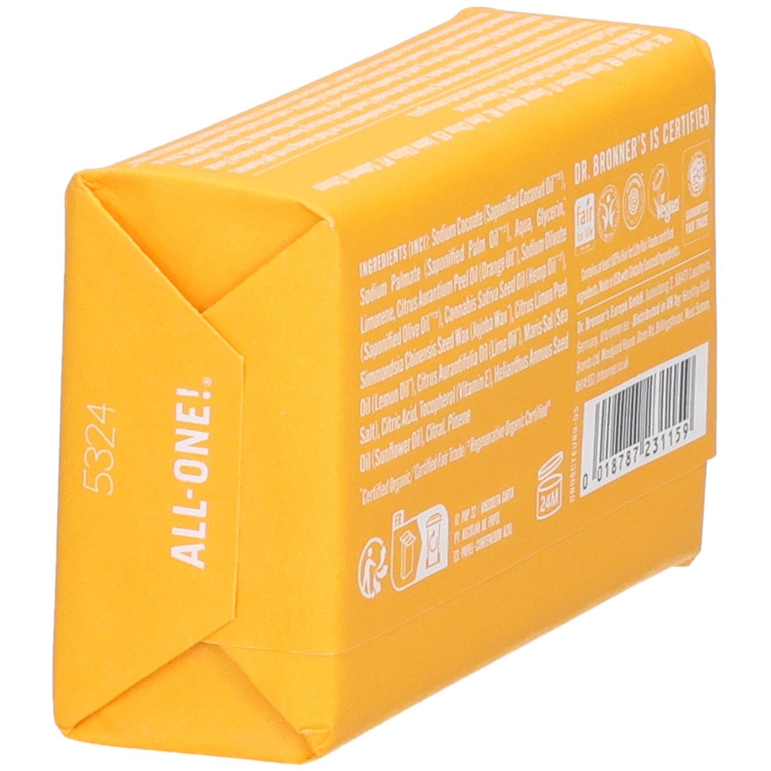 Dos d'un pain de savon jaune. Liste ingrédients, certifications, code-barres et informations fabricant. Vue oblique.