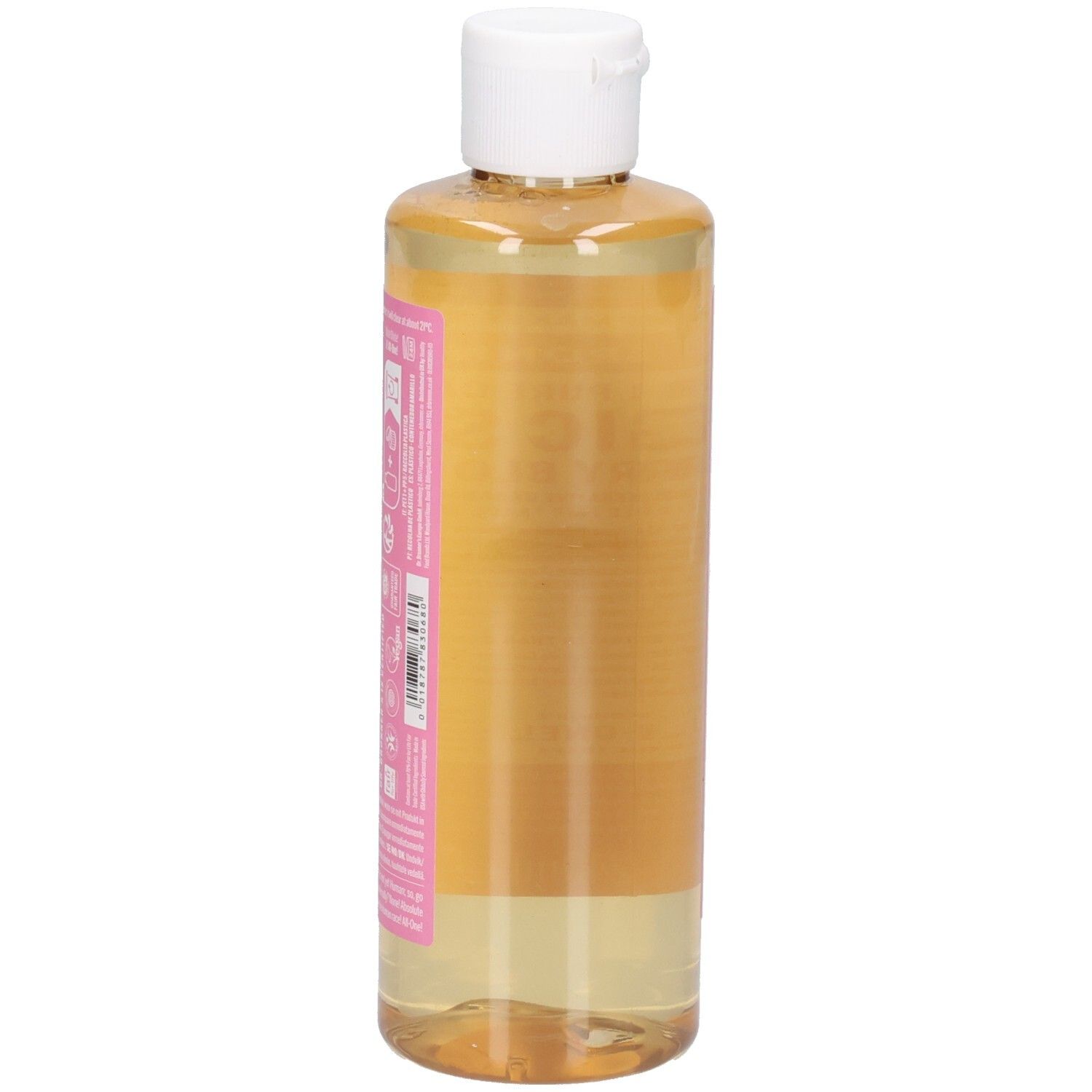 Vue latérale de la bouteille de savon liquide. Étiquette rose avec texte. Bouchon blanc. Liquide clair visible.