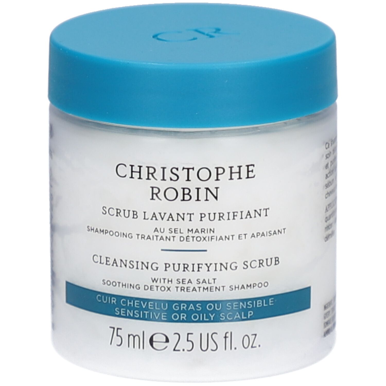 Pot blanc avec couvercle bleu. Inscription: CHRISTOPHE ROBIN, SCRUB LAVANT PURIFIANT, CLEANSING PURIFYING SCRUB. Pour cuir chevelu gras ou sensible.