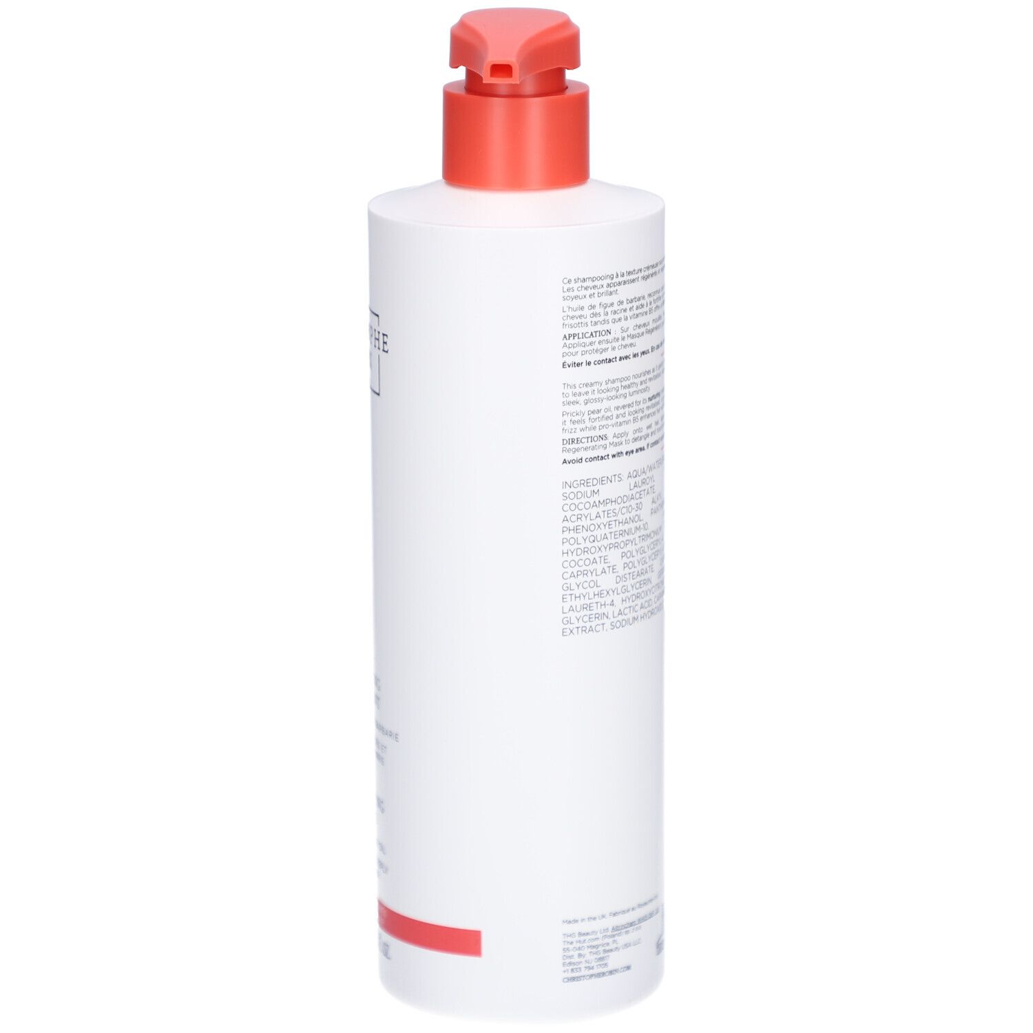 Dos d'un flacon blanc avec pompe rouge. Texte sur l'étiquette.