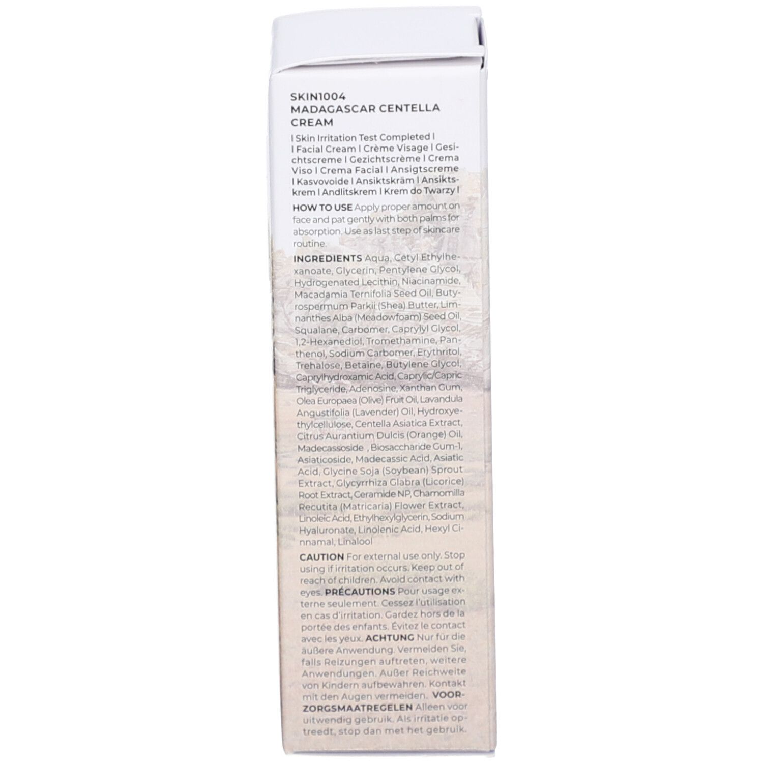 Dos de l'emballage. Texte: SKIN1004 MADAGASCAR CENTELLA. Ingrédients, utilisation, précautions.