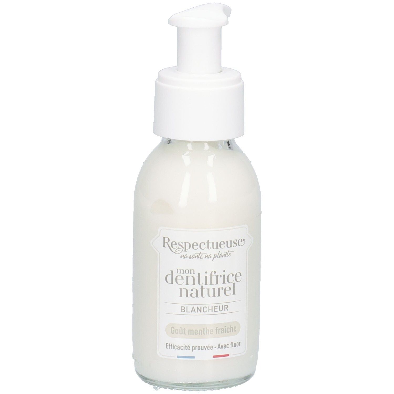 Flacon en verre blanc avec pompe. Inscription: "Respectueuse mon dentifrice naturel blancheur". Goût menthe fraîche.