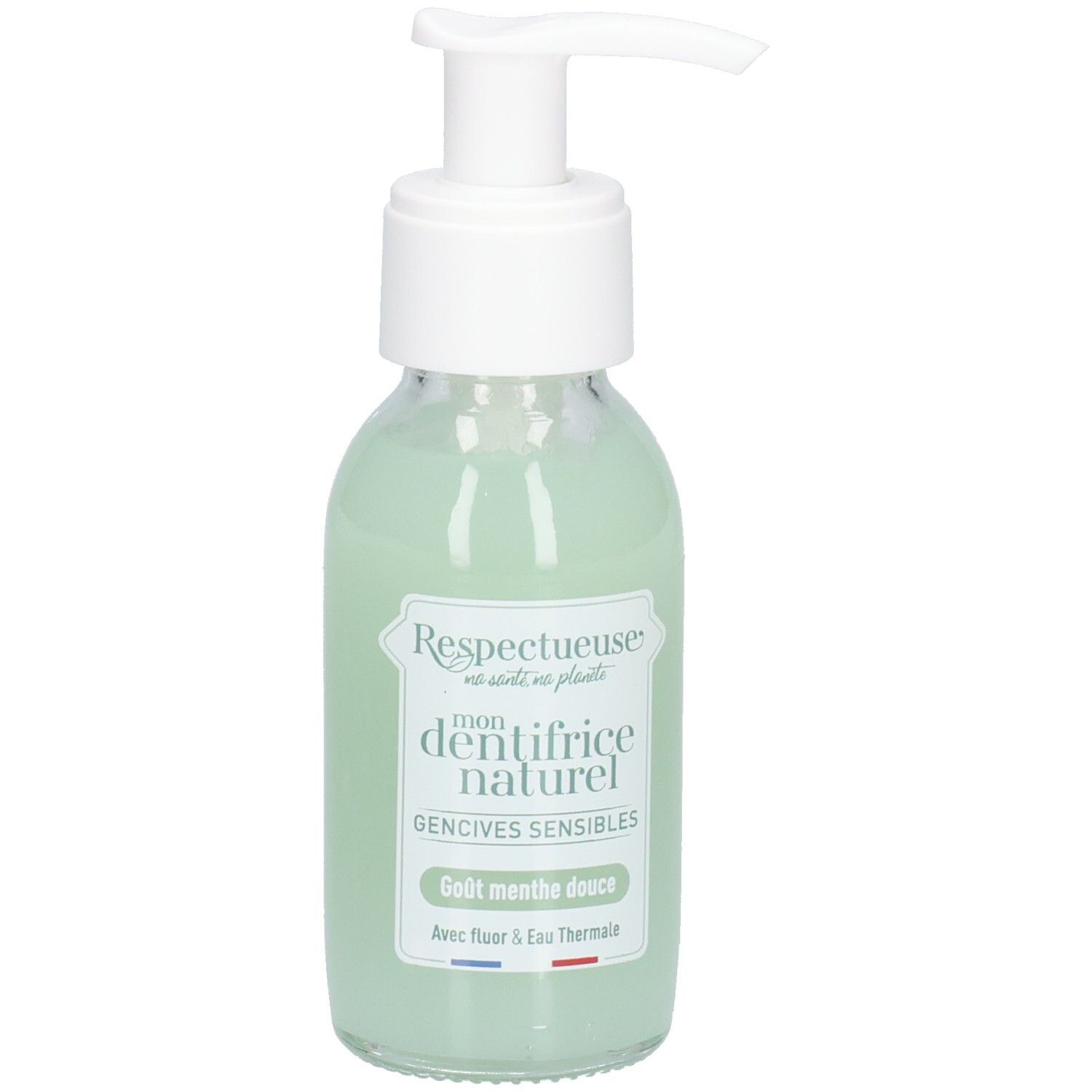 Flacon en verre avec pompe blanche, contenant un liquide vert. Étiquette: "Respectueuse", "dentifrice naturel", "Gencives sensibles".