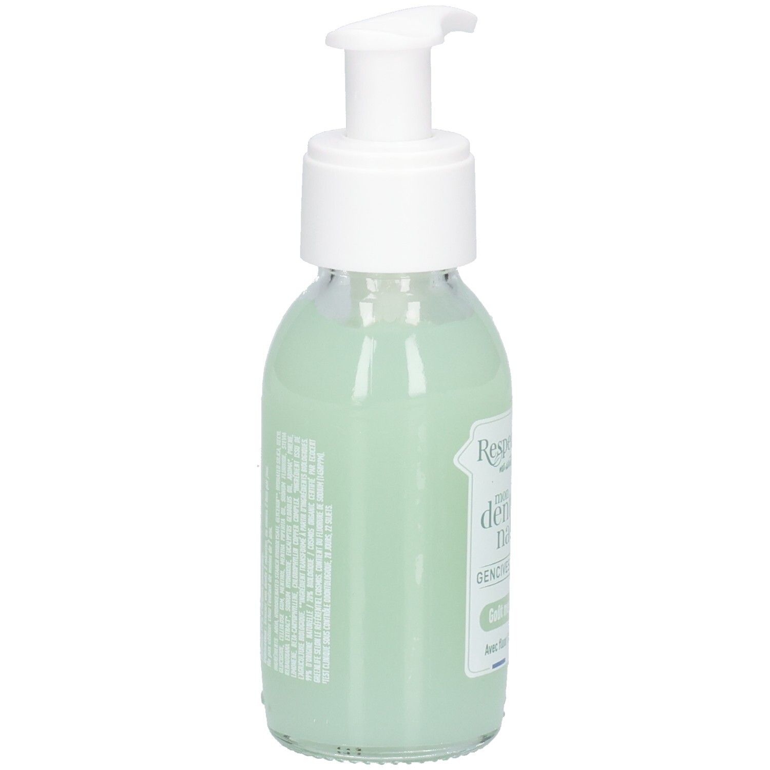Flacon en verre avec pompe blanche, rempli de liquide vert. Étiquette avec texte. Vue arrière.