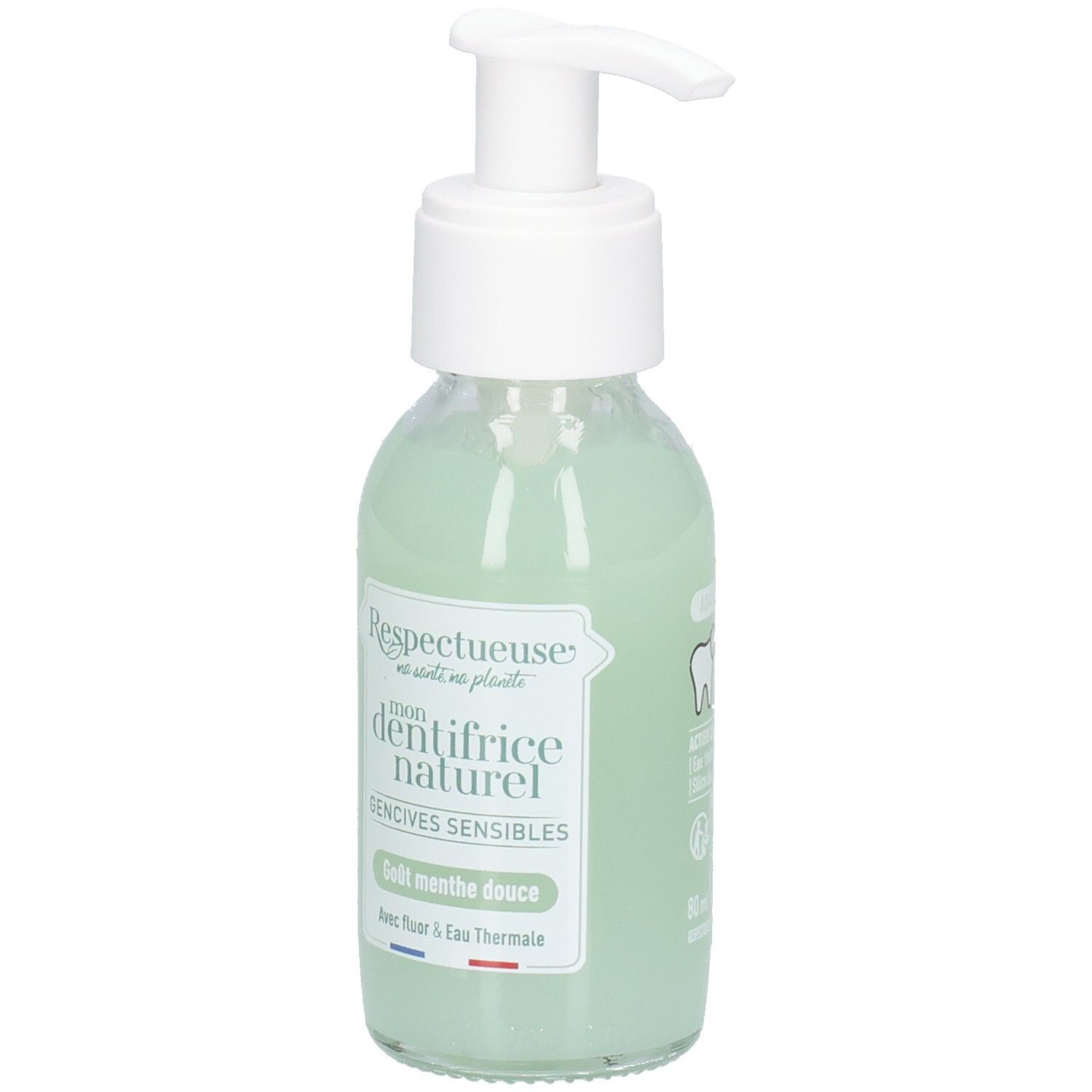 Flacon en verre avec pompe blanche, liquide vert. Étiquette: "Respectueuse", "dentifrice naturel", "Gencives sensibles".