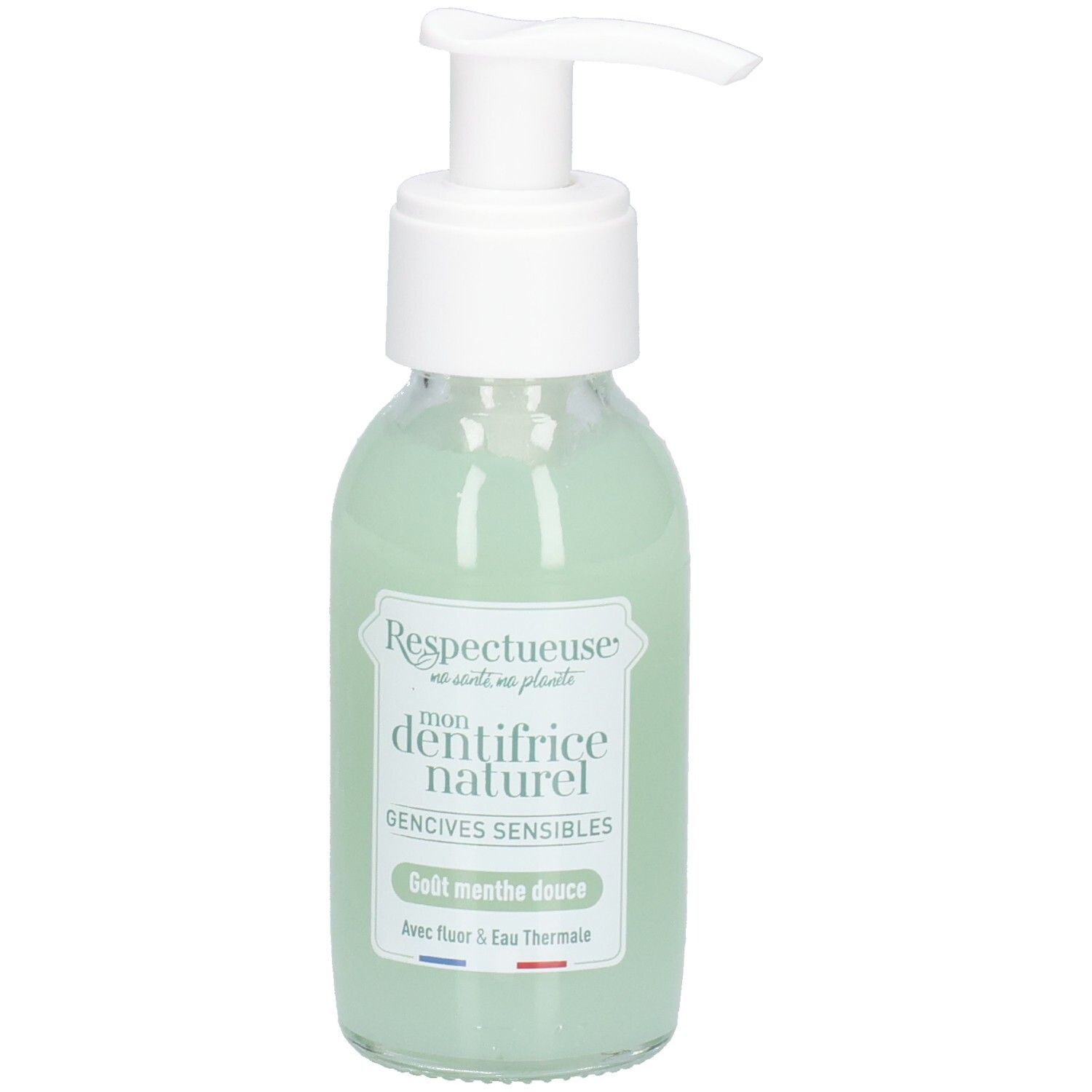 Flacon en verre avec pompe blanche, liquide vert. Étiquette: "Respectueuse", "dentifrice naturel", "Gencives sensibles".