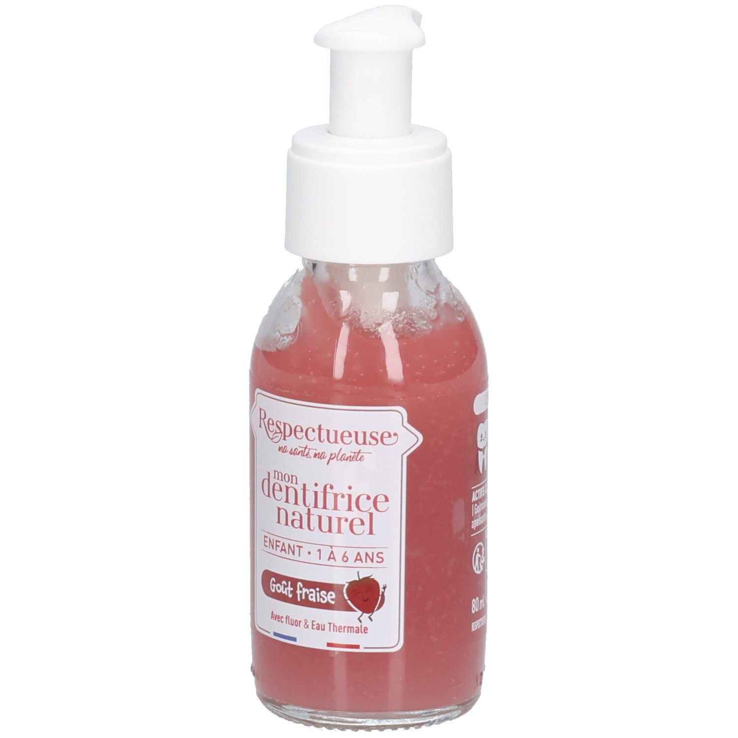 Flacon en verre avec pompe blanche, contenant un liquide rose. Étiquettes: "Respectueuse", "dentifrice naturel", "Goût fraise".