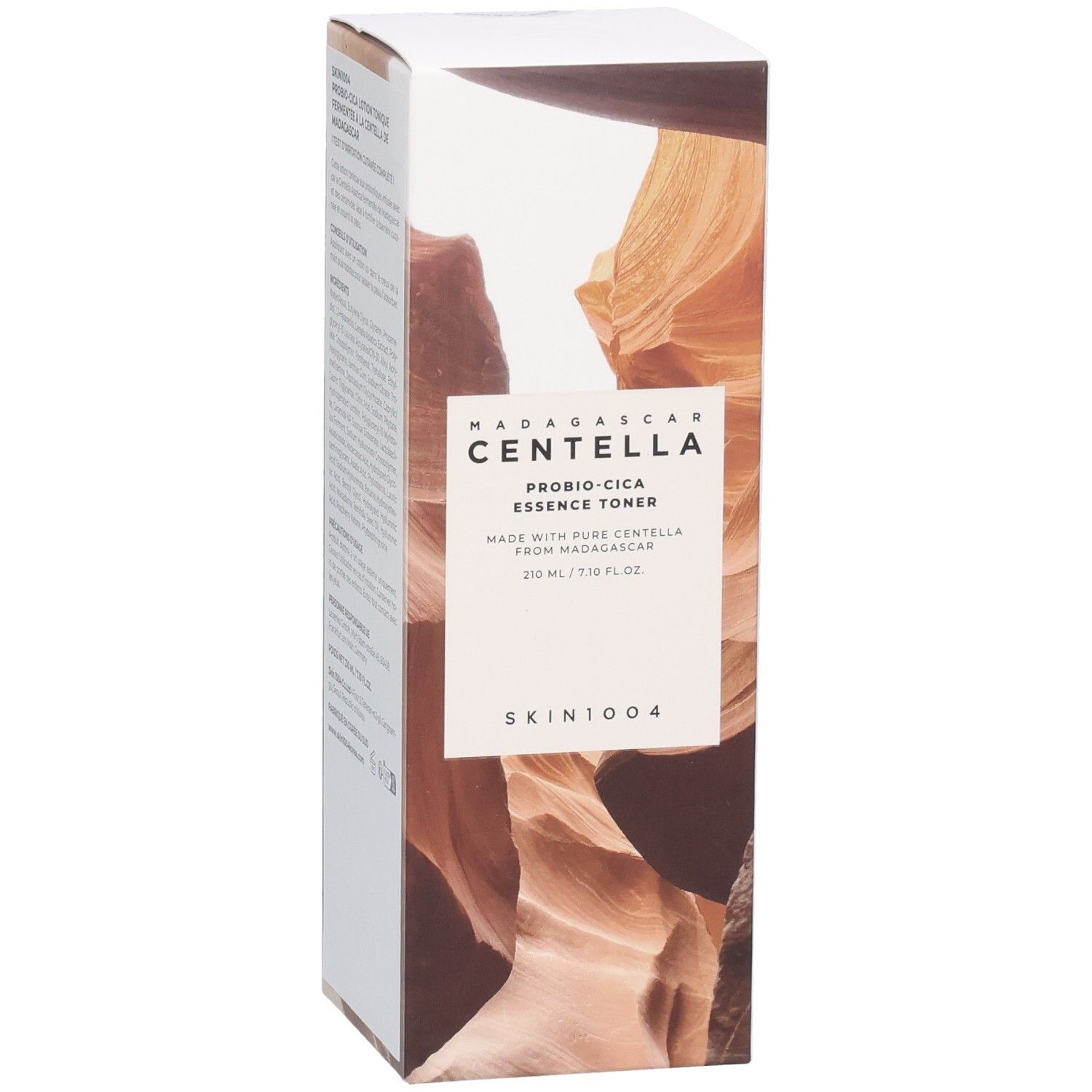Emballage produit avec motif paysage brun. Texte: MADAGASCAR CENTELLA, PROBIO-CICA ESSENCE TONER, SKIN1004.