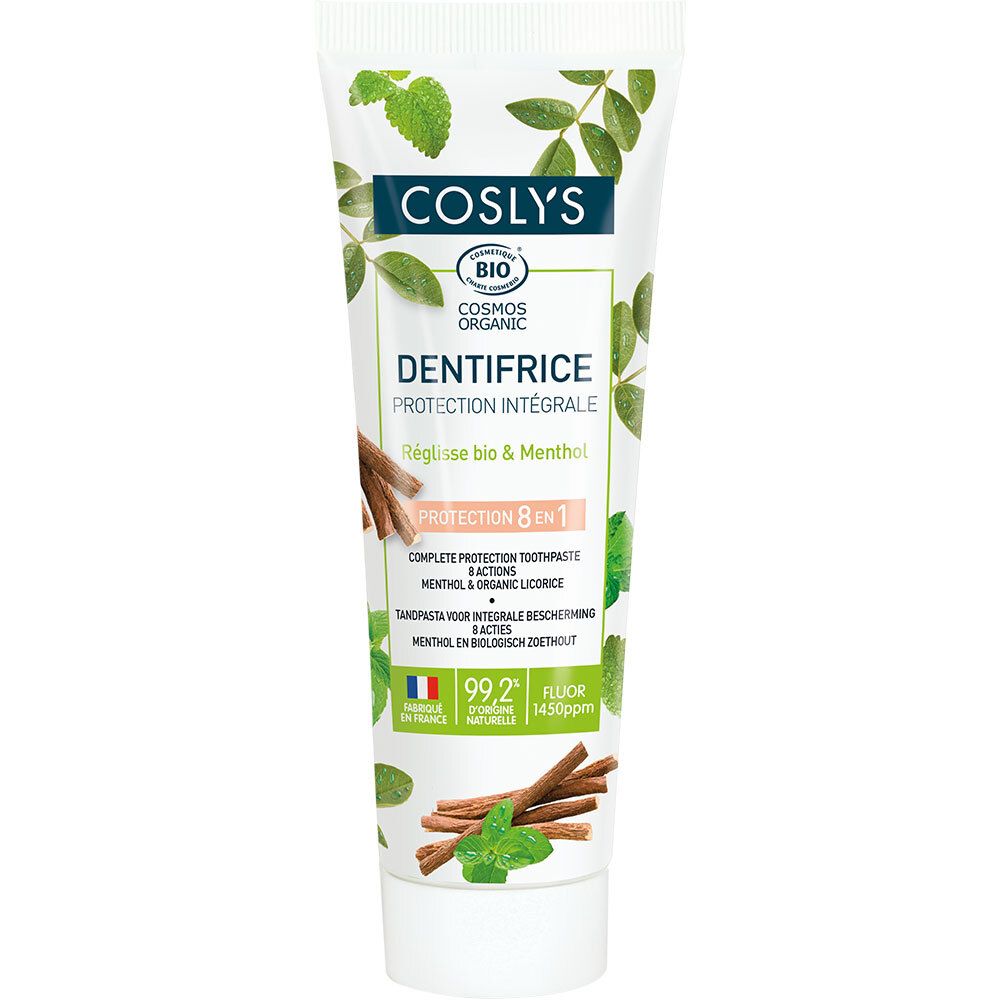 Tube de dentifrice Coslys Dentifrice Protection Intégrale. Blanc, motifs verts et bruns. Inscription : 'Protection 8 en 1'.