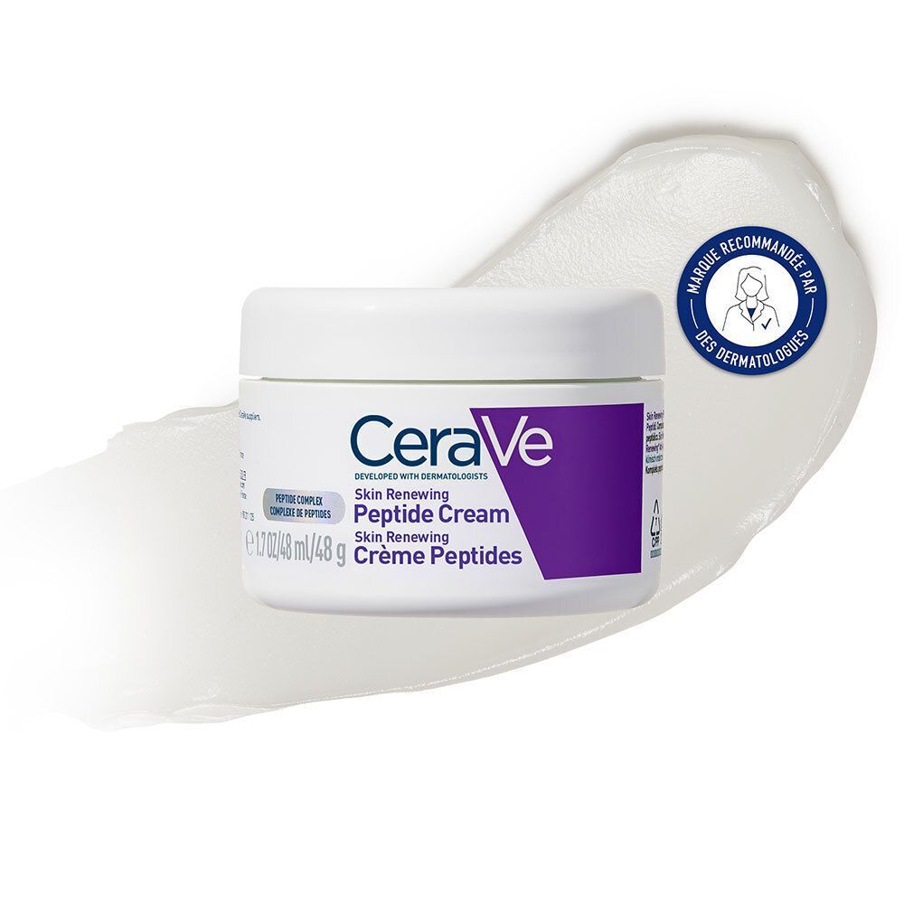 Pot blanc avec des accents violets et une trace de crème. Inscription : CeraVe Skin Renewing Peptide Cream.