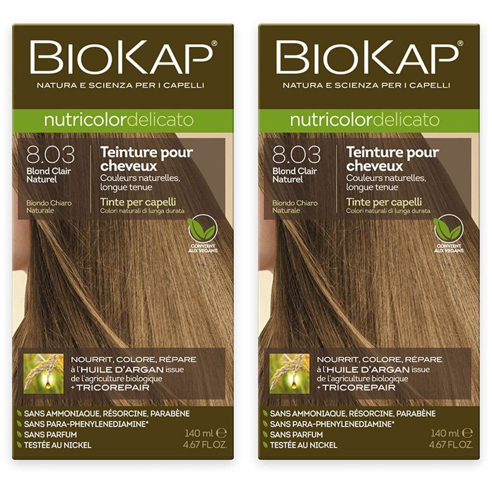 Deux boîtes de teinture pour cheveux BIOKAP Nutricolor Delicato. Inscription: 8.03 Blond Clair Naturel. Contient de l'huile d'argan. Vegan.