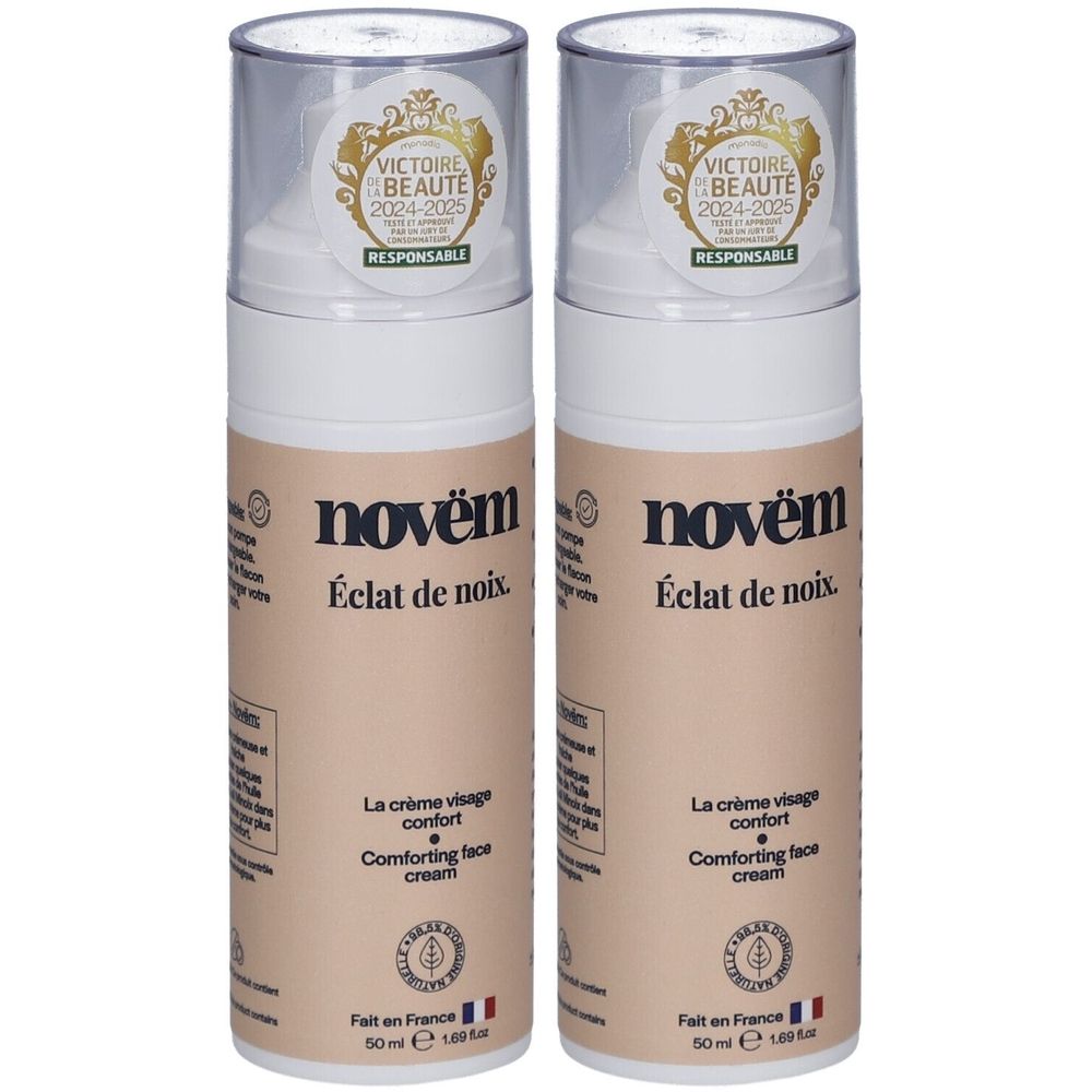 Deux flacons crème avec bouchons transparents. Inscription: novèm, Éclat de noix, La crème visage confort, Comforting face cream. Label.