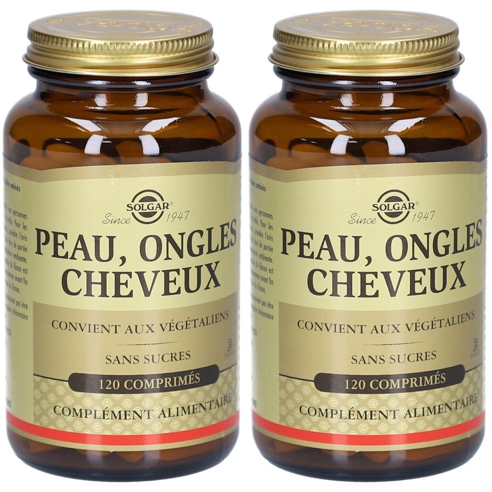 Deux flacons en verre brun avec des couvercles dorés. Étiquettes avec "PEAU, ONGLES, CHEVEUX" et "120 COMPRIMÉS". Marque : SOLGAR.