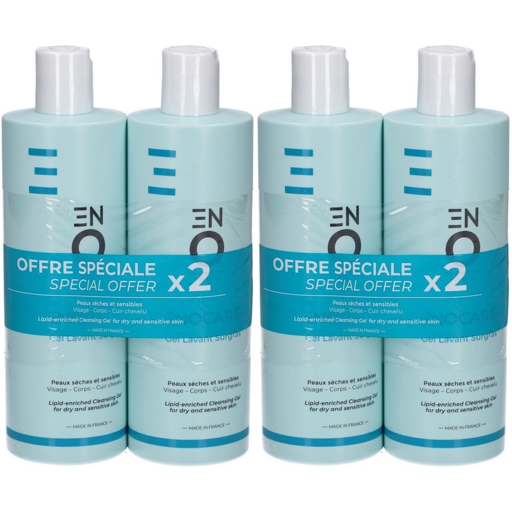 Quatre flacons ENOCARE Gel Lavant Surgras, bleu clair, bouchons blancs. Inscription : "OFFRE SPÉCIALE x2".