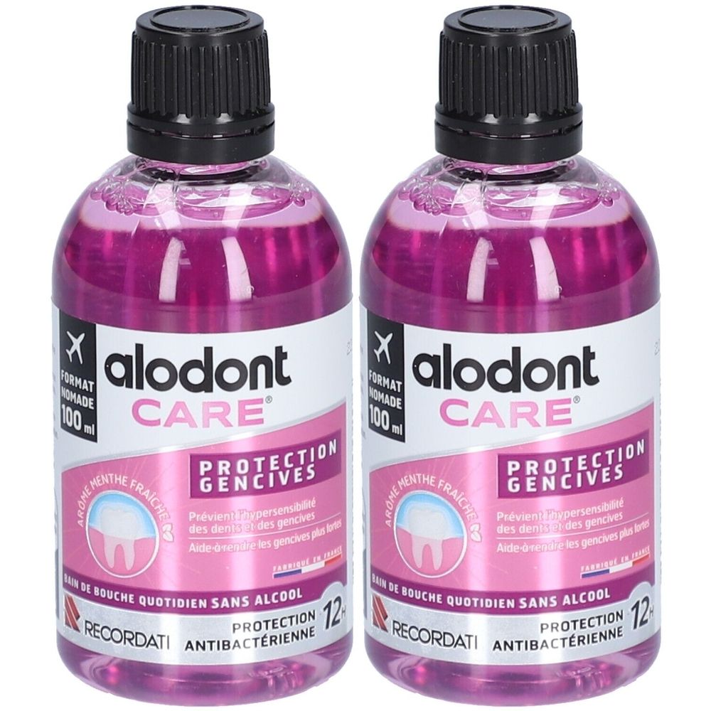 Deux flacons de bain de bouche. Bouchon noir. Inscription: alodont CARE, PROTECTION GENCIVES. Liquide rose.