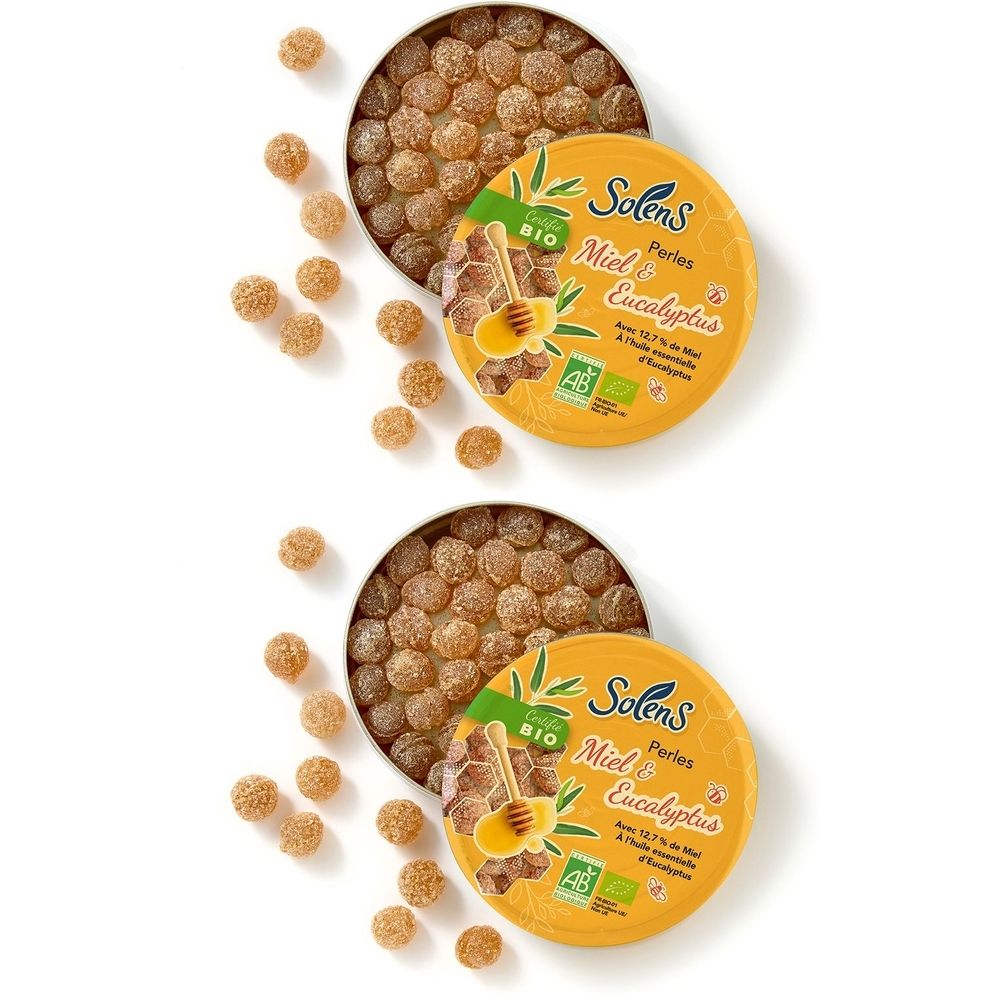 Deux boîtes rondes avec des perles marron. Sur une boîte, "Solens Perles Miel & Eucalyptus". Label bio.