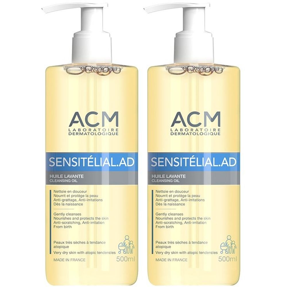Deux flacons de liquide jaunâtre avec pompe. Inscriptions: ACM Laboratoire Dermatologique, SENSITÉLIAL.AD, Huile Lavante. 500ml.