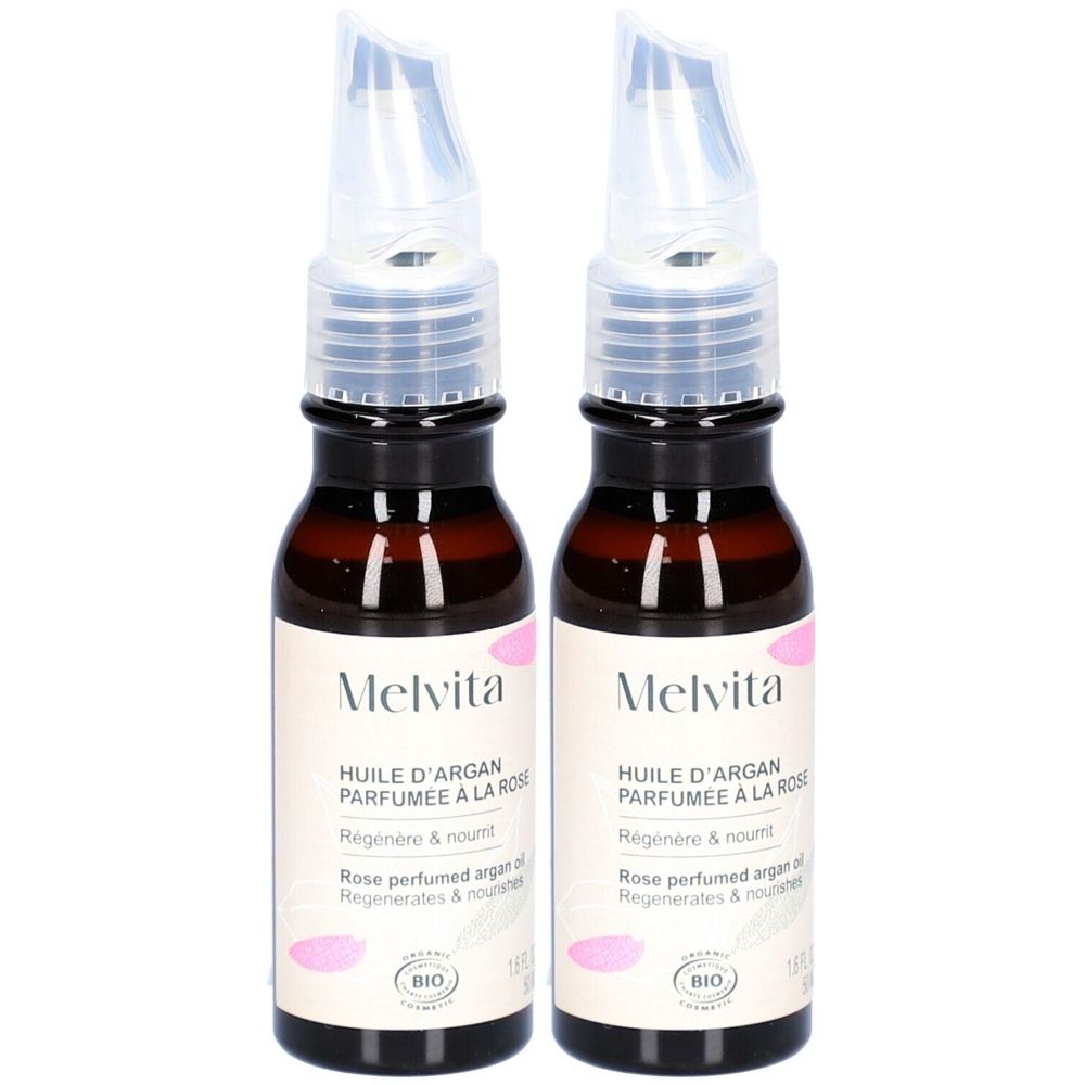 Deux flacons d'huile brune avec applicateur transparent. Inscription: Melvita, Huile d'Argan Parfumée à la Rose, Bio.