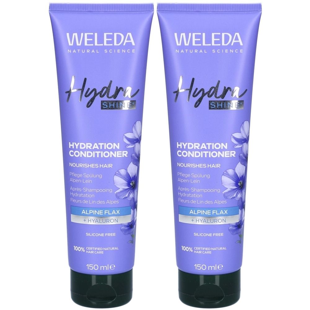 Deux tubes de revitalisant. Tubes violets avec texte blanc. Inscription: WELEDA, Hydra Shine, Hydration Conditioner, Alpine Flax + Hyaluron. 150 ml.