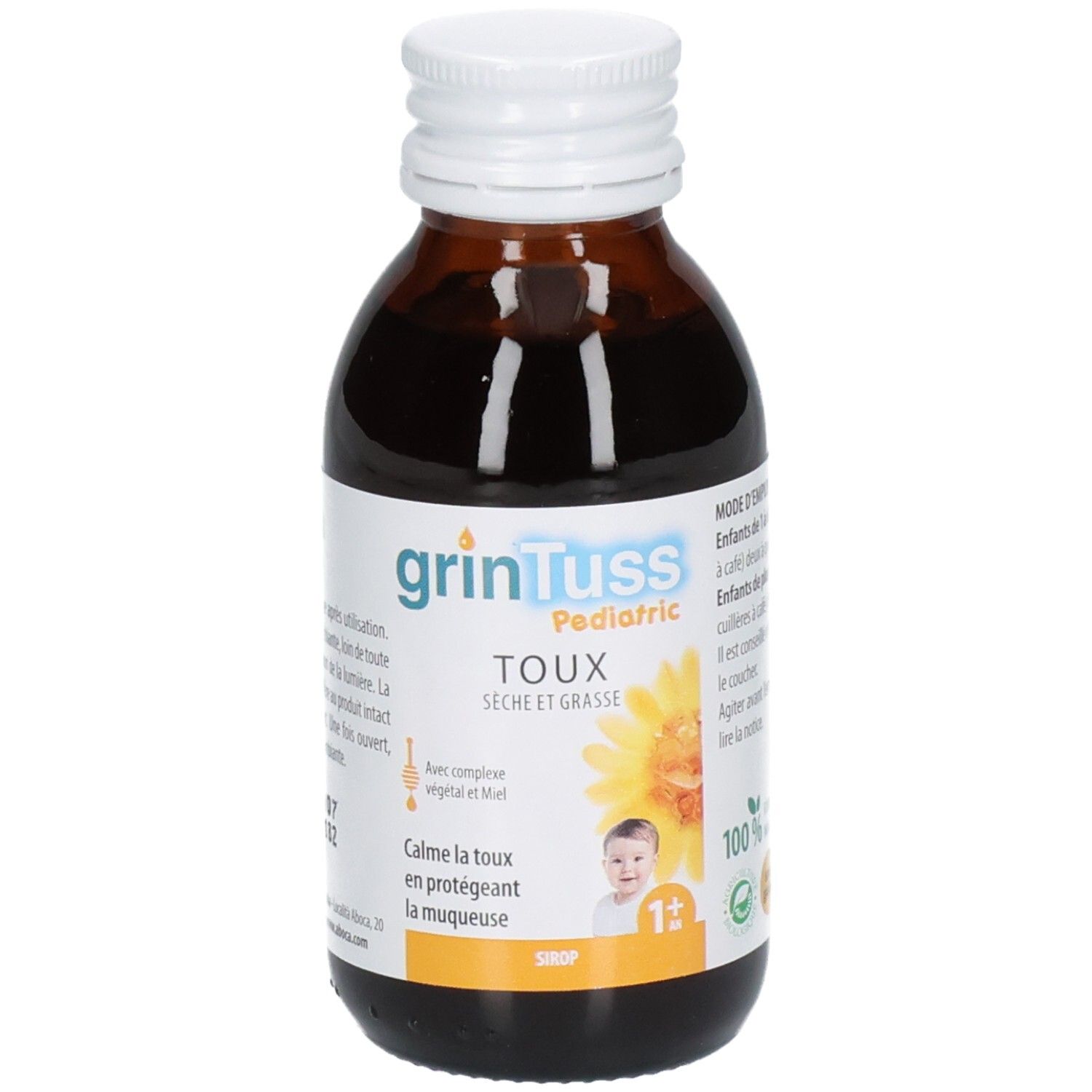 Bouteille de sirop foncé, étiquette indiquant "grintuss Pediatric", "Toux", "sèche et grasse" et un tournesol.