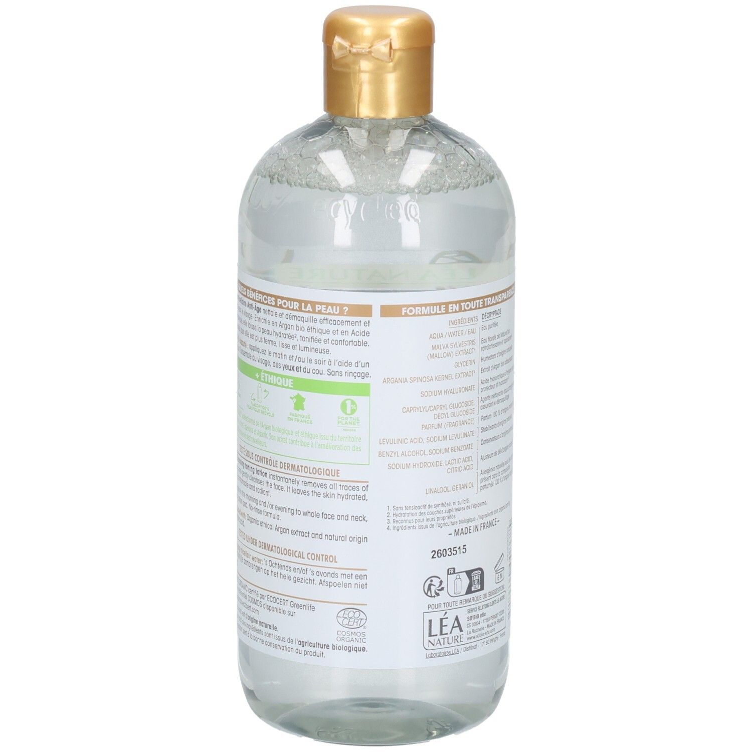 Vue arrière du flacon. Étiquette avec texte. Bouchon doré. Liquide transparent visible.