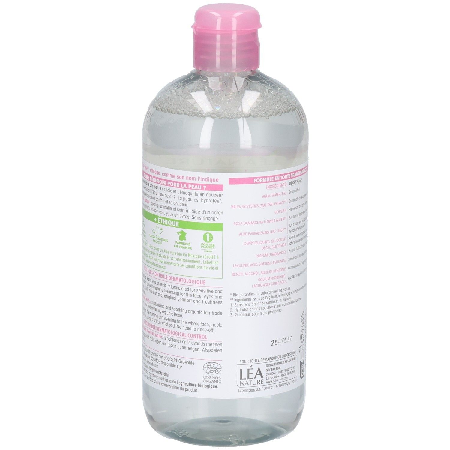 Dos du flacon. Étiquette avec texte et logos. Nom et logo du produit partiellement visibles.