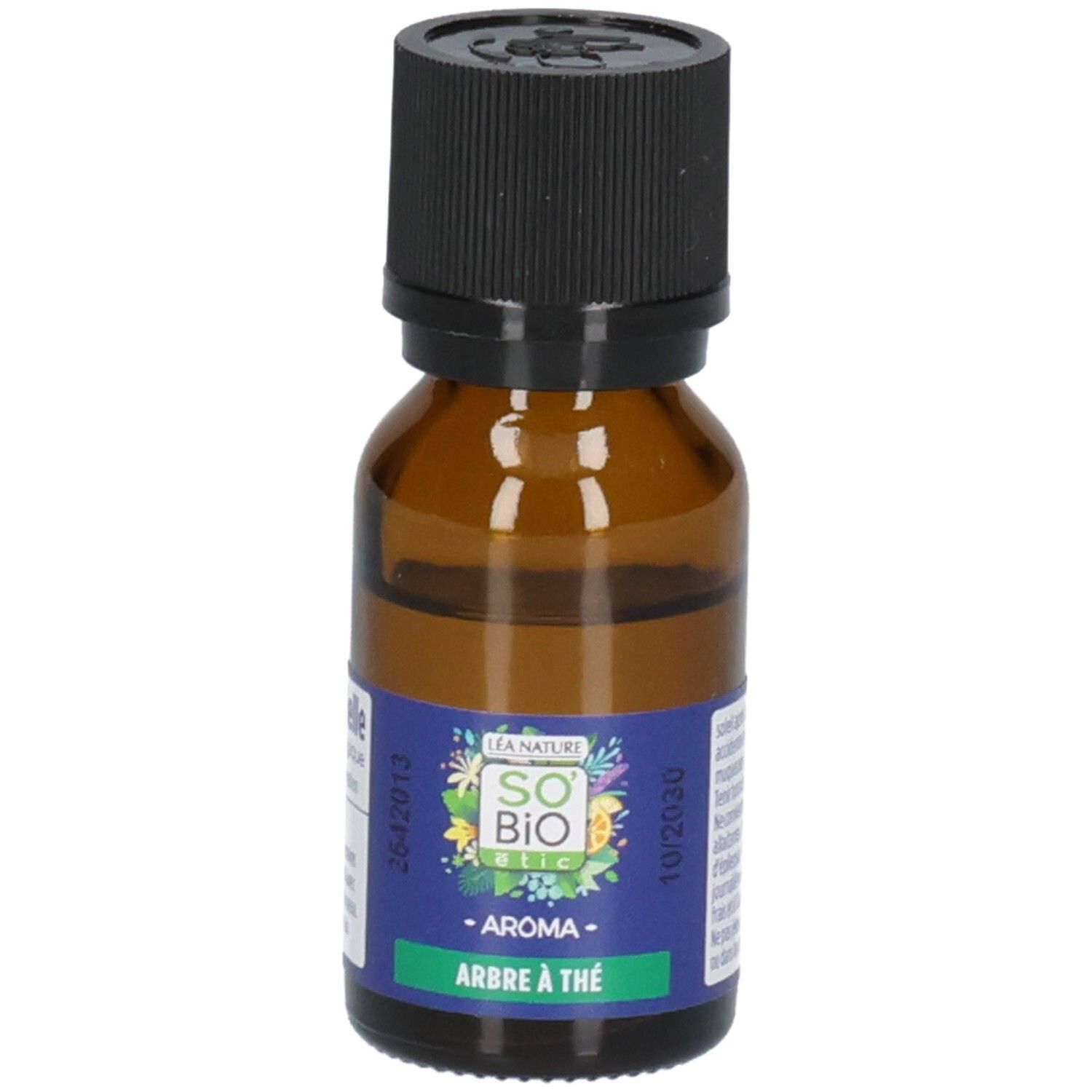 Flacon en verre brun avec bouchon noir. Étiquette avec informations produit. Inscription: Arbre à Thé.