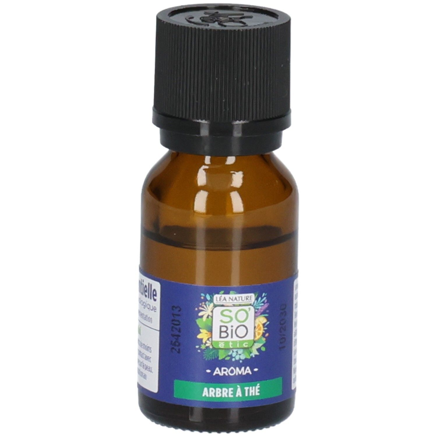 Flacon en verre brun avec bouchon noir. Étiquette avec informations produit. Inscription: Arbre à Thé.