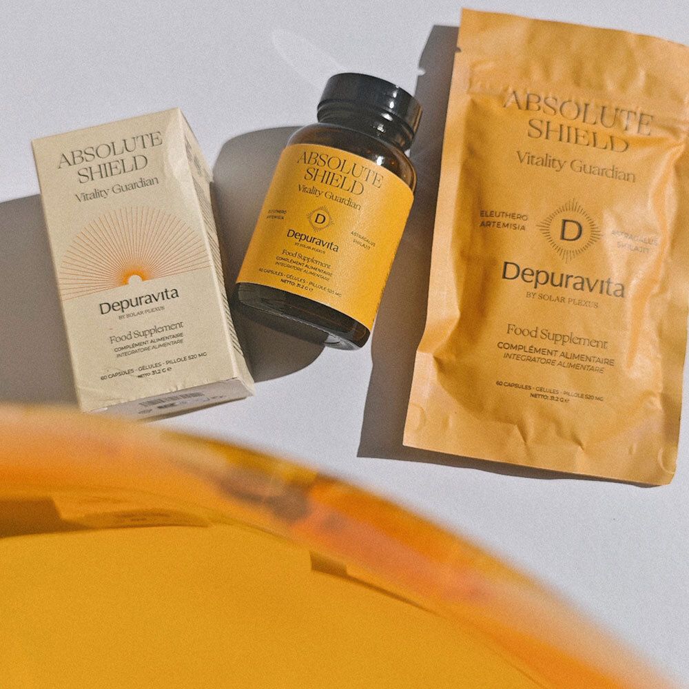 Trois produits: boîte, flacon et sachet. Inscription ABSOLUTE SHIELD, Depuravita. Complément alimentaire. Sceau avec lettre D.