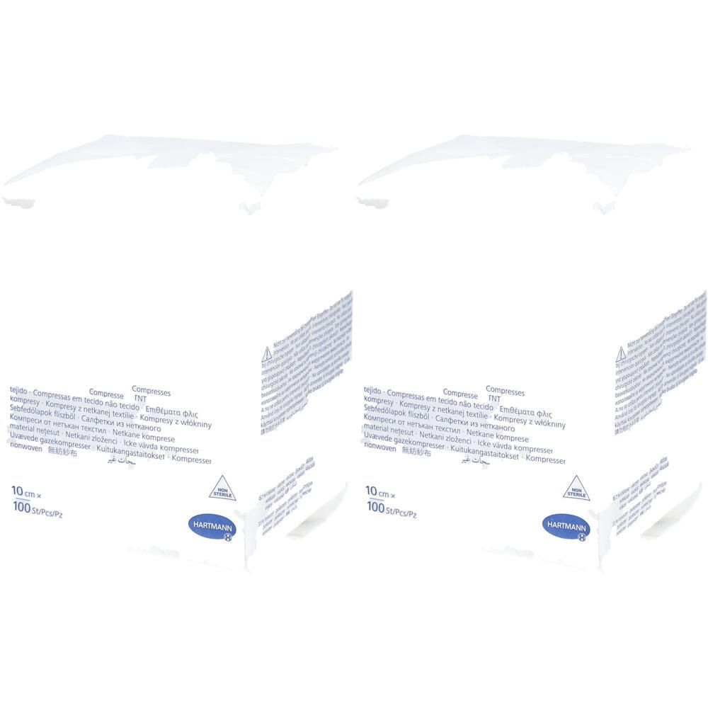 Paquet de compresses. Emballage blanc rectangulaire avec texte et logo. Marque Hartmann. 10 cm x 10 cm, 100 pièces.