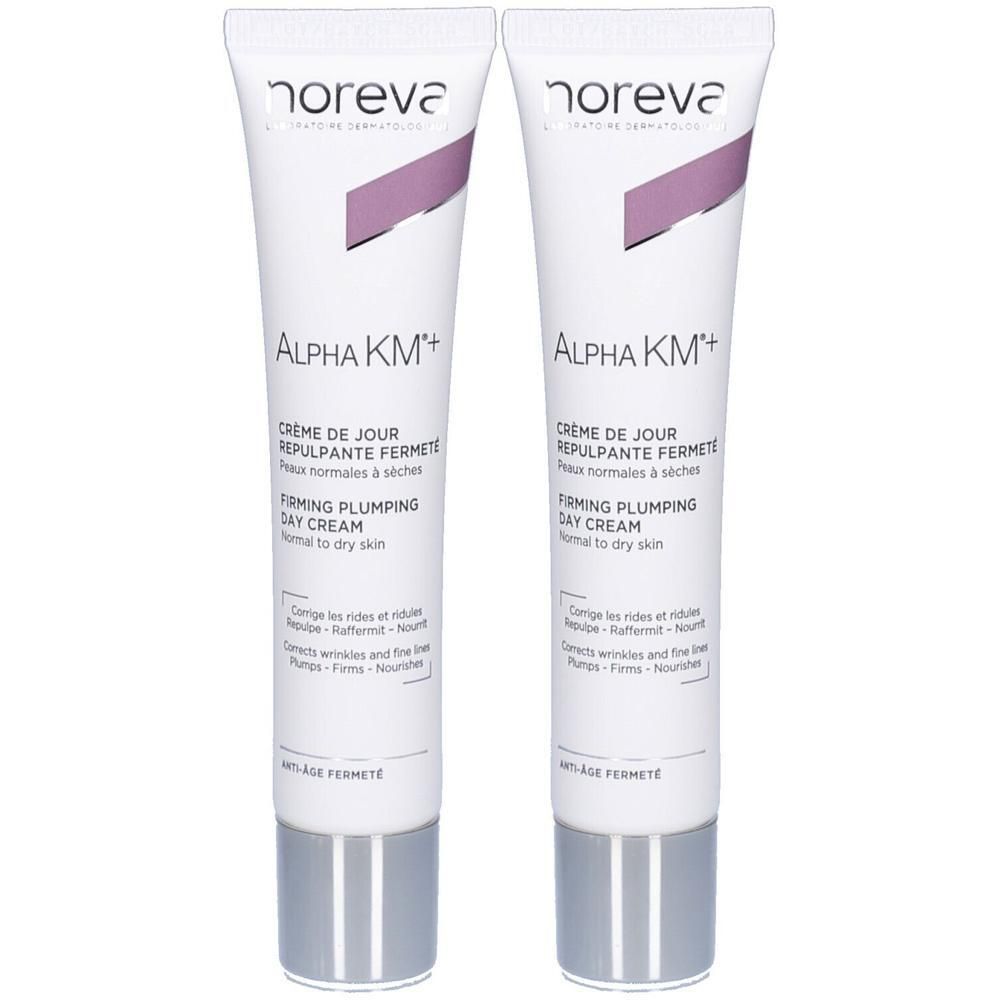 Deux tubes de crème. Inscription: Alpha KM+, Crème de jour repulpante fermeté, Firming plumping day cream. Marque: Noreva.
