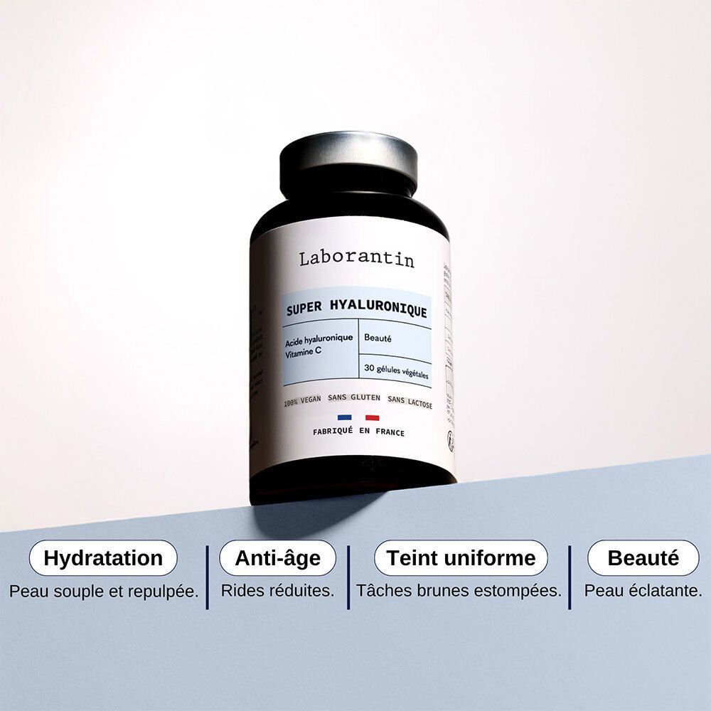 Un flacon noir avec couvercle argenté. Étiquette "Laborantin Super Hyaluronique". Texte sur Hydratation, Anti-âge, Teint uniforme, Beauté.