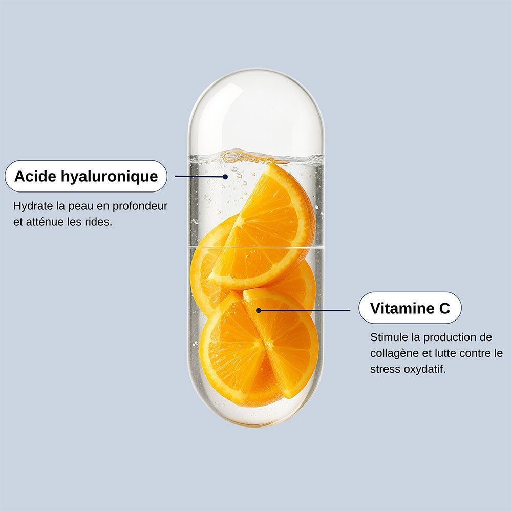 Une gélule avec acide hyaluronique et vitamine C. Tranches d'orange à l'intérieur.