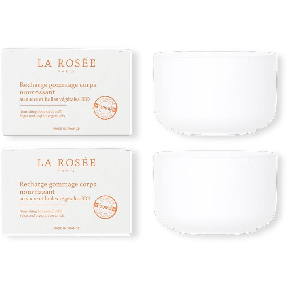 Deux boîtes rectangulaires et deux récipients blancs ronds. Sur les boîtes, on lit "LA ROSÉE PARIS" et "Recharge gommage corps nourrissant".