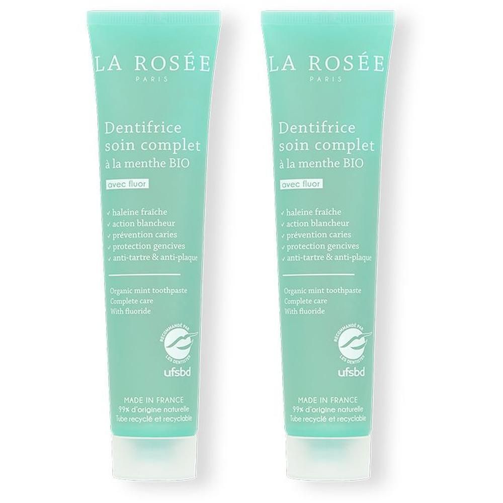 Deux tubes de dentifrice vert. Inscription : LA ROSÉE, Dentifrice soin complet à la menthe BIO. Avec fluor. Certification UFSBD.