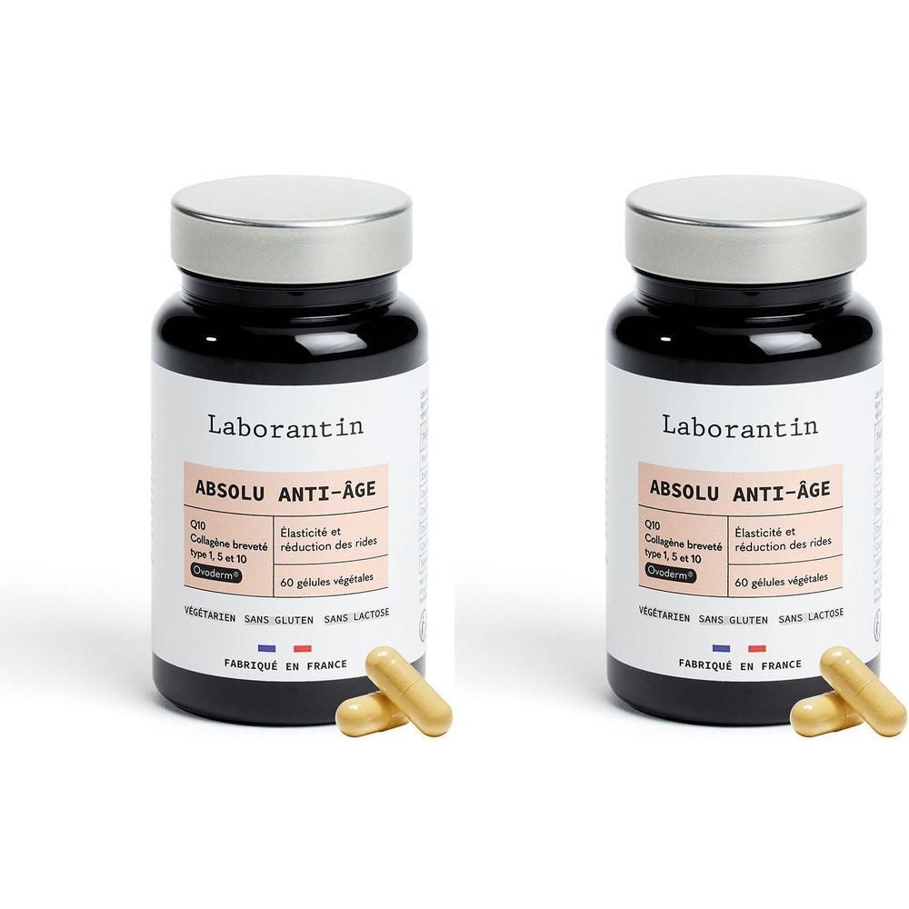Deux flacons Laborantin Absolu Anti-Âge. Flacons noirs, couvercles argentés. Gélules jaunes à côté.
