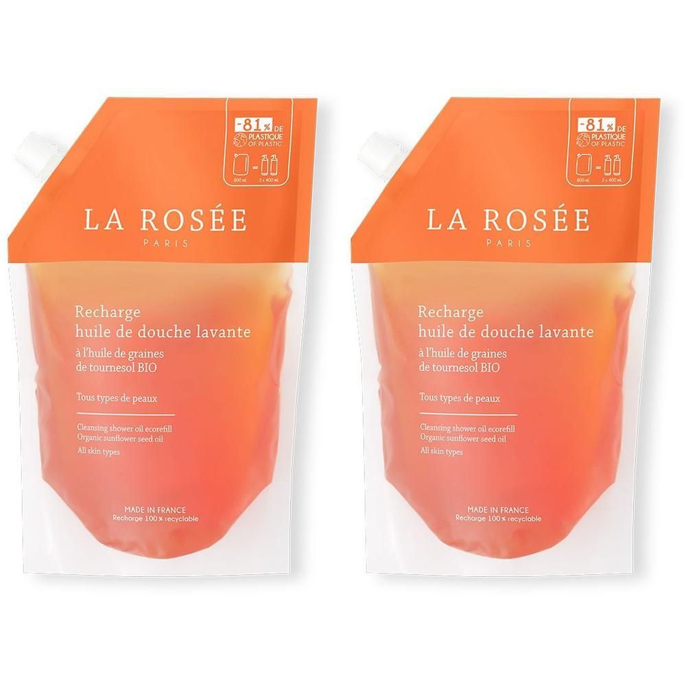 Deux recharges de douche lavante LA ROSÉE. Contiennent de l'huile de tournesol. Emballage orange et blanc, avec texte en français.