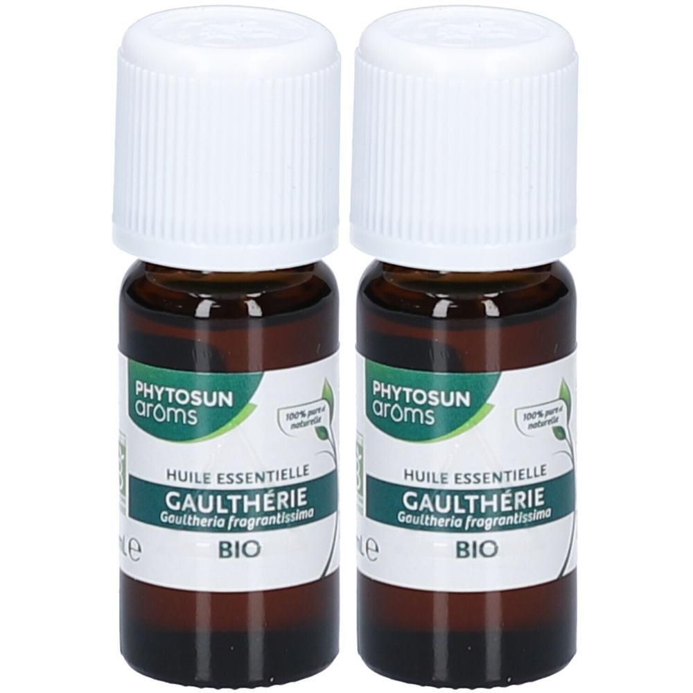 Deux flacons en verre brun avec bouchons blancs. Étiquettes : "PHYTOSUN arôms", "HUILE ESSENTIELLE GAULTHERIE BIO".