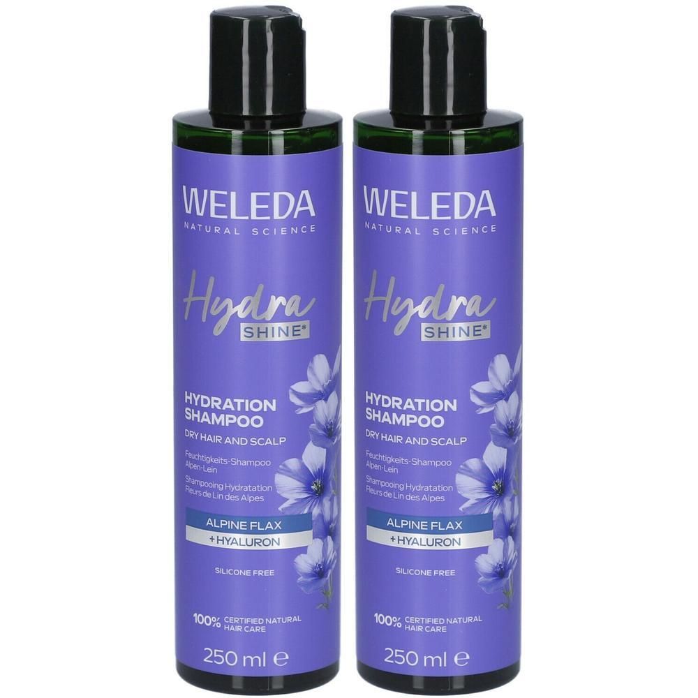 Deux flacons de shampooing violets avec bouchons noirs. Inscription: WELEDA, Hydra Shine, Hydration Shampoo, Alpine Flax + Hyaluron. 100% soins capillaires naturels certifiés.