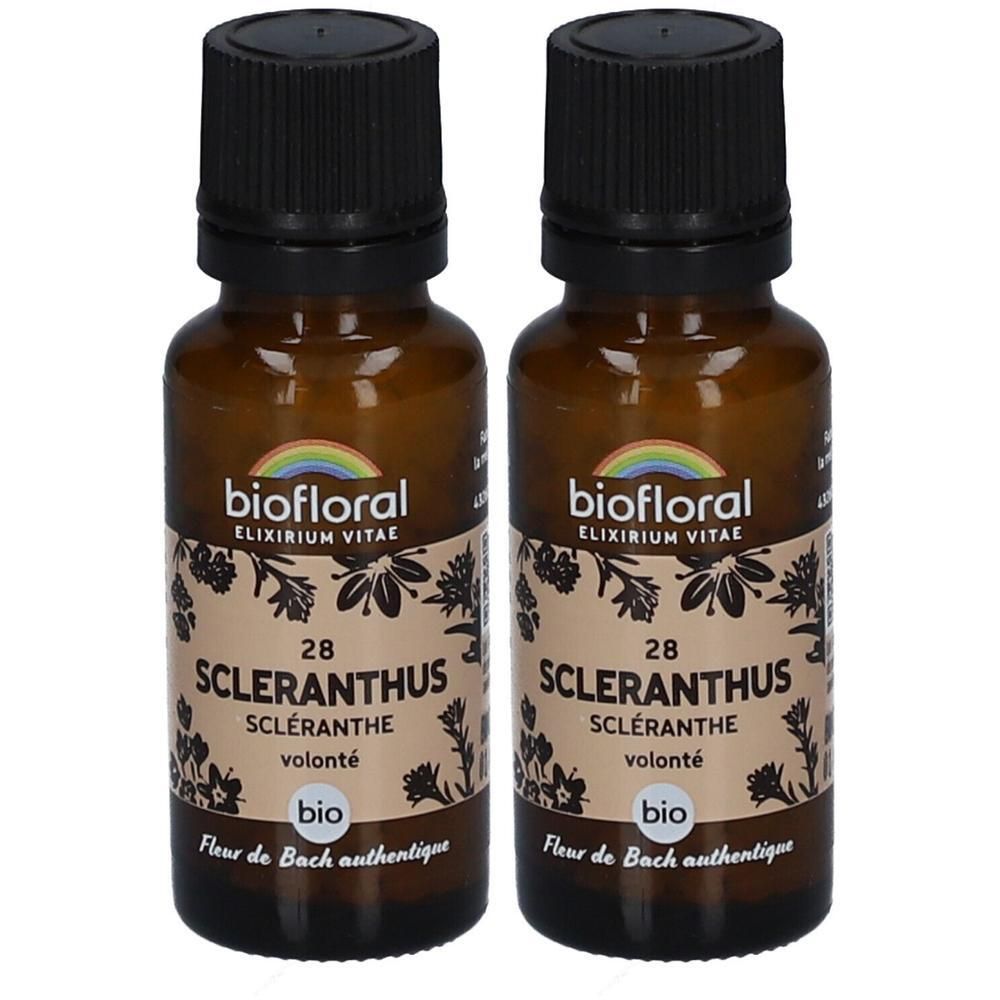 Deux flacons en verre brun avec bouchons noirs. Étiquettes avec "biofloral", "28 Scleranthus", "Fleur de Bach authentique".