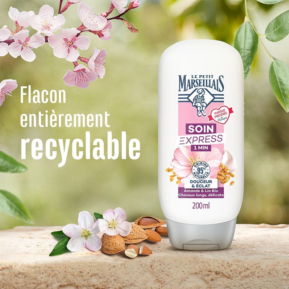 Flacon avec étiquette rose. Inscription : Le Petit Marseillais, Soin Express 1 Min, Douceur & Éclat, Amande & Lin Bio. Texte : Flacon entièrement recyclable.