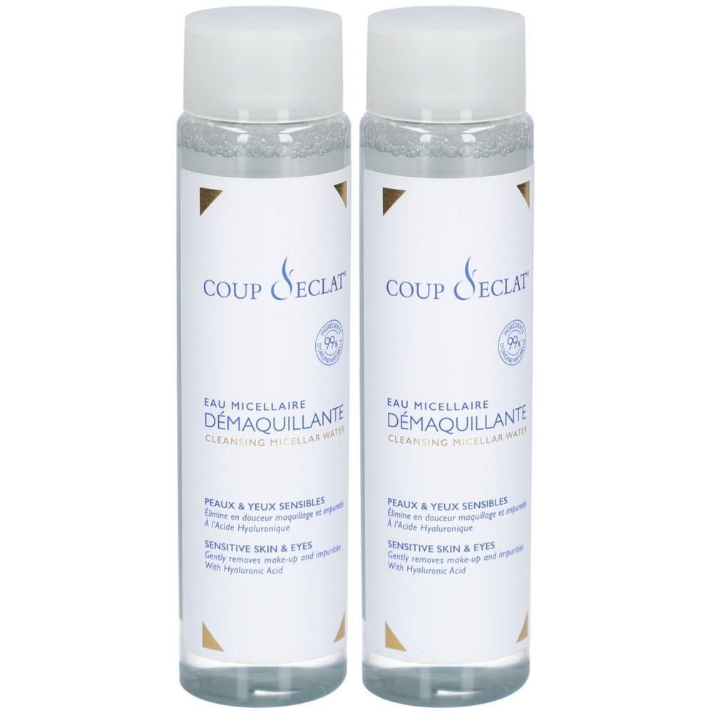 Deux flacons avec bouchons blancs. Inscription: COUP D'ECLAT, EAU MICELLAIRE DEMAQUILLANTE. Pour peaux et yeux sensibles.