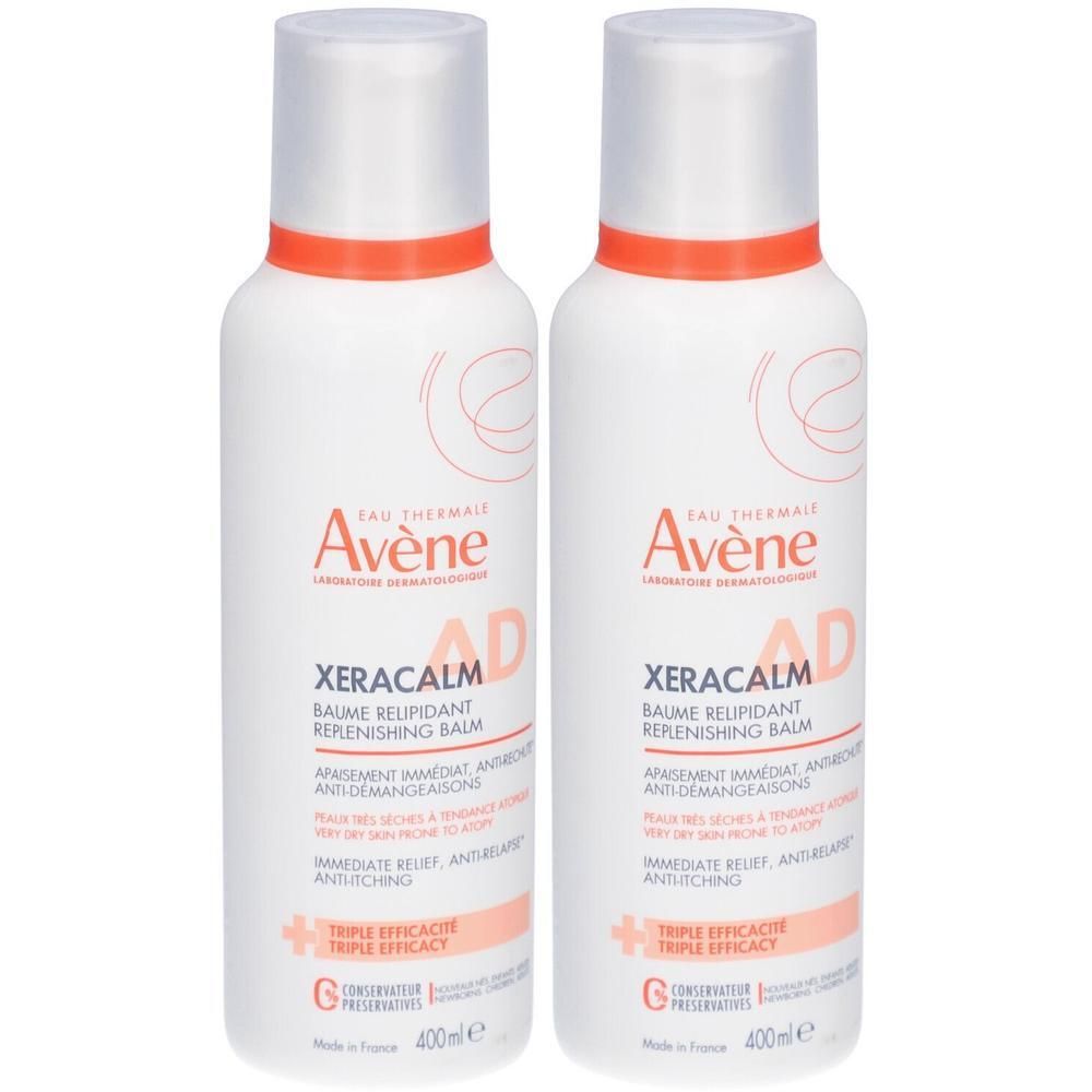Deux flacons blancs avec des accents orange. Chaque flacon porte la mention "Avène XERACALM AD" et d'autres informations.